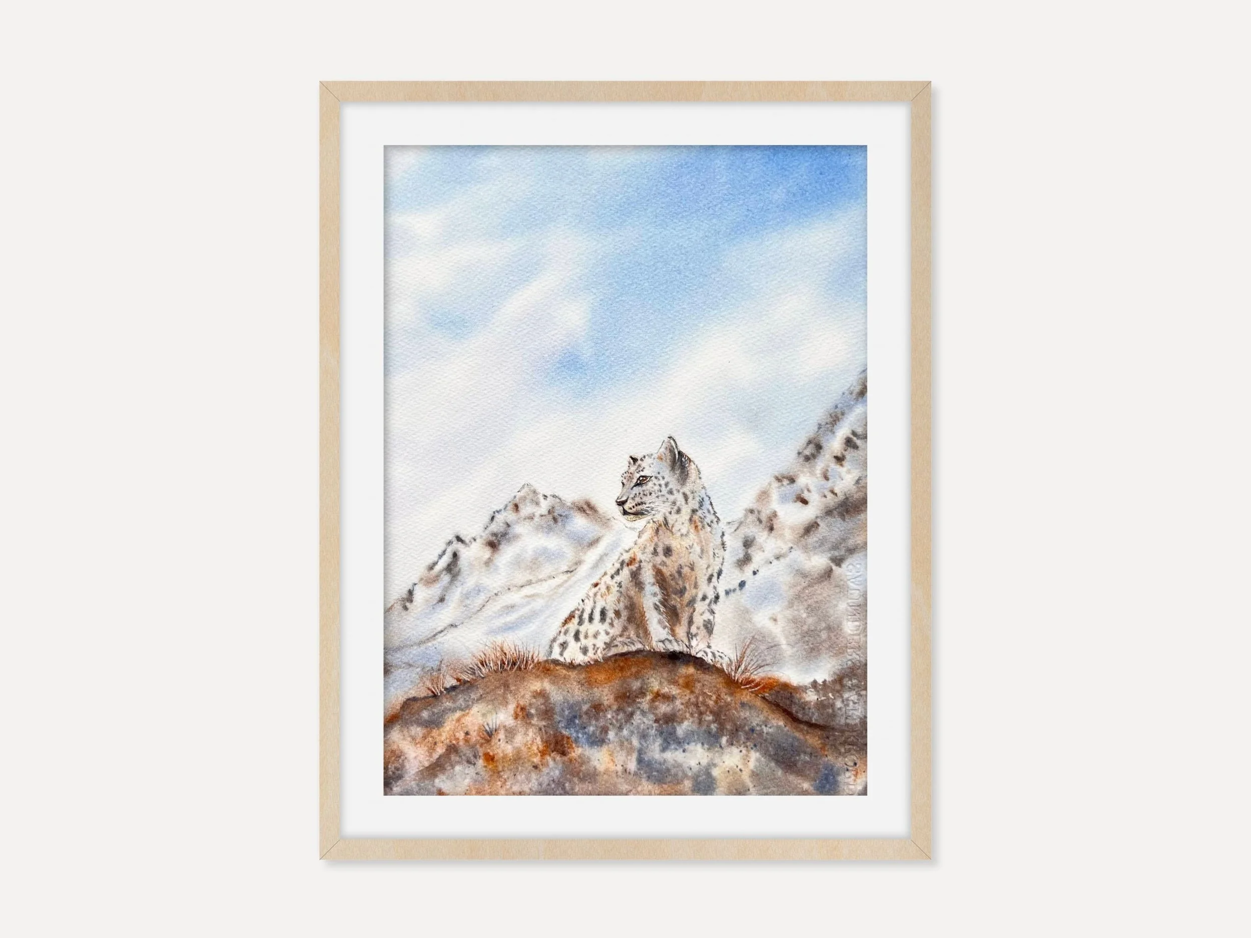 This si an Original Wildlife Watercolor Painting of a Snow Leopard siting on a brown mossy cliff in front of a snowy mountain in a brown frame.