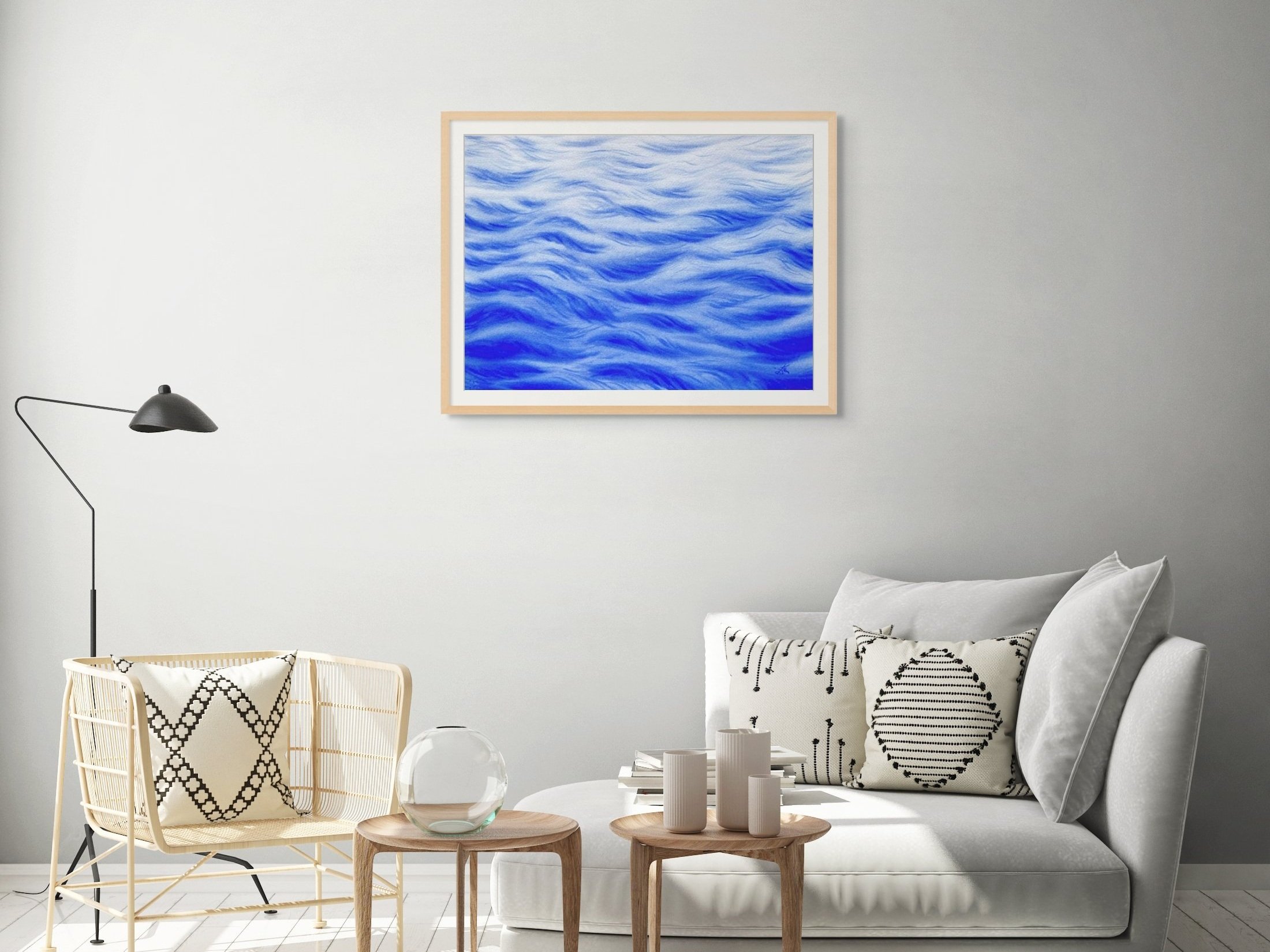 Original watercolor painting "A Touch of Wind" framed and staged in a living room, adding a refreshing, airy vibe with its soft waves and light accents.