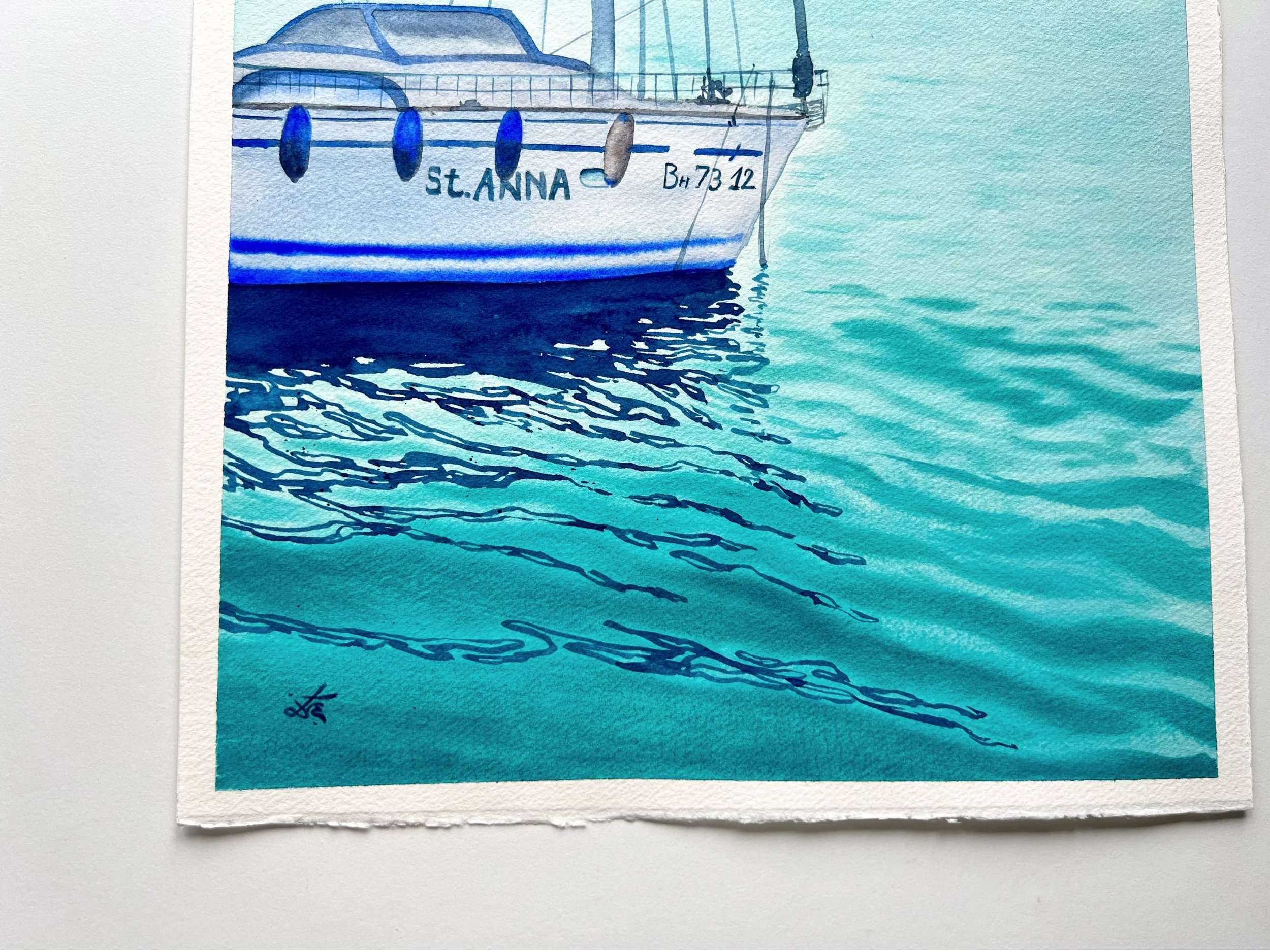 Closeup of the original watercolor painting "St. Anna" featuring a sailboat at Varna’s pier with soft, tranquil hues and gorgeous reflections.
