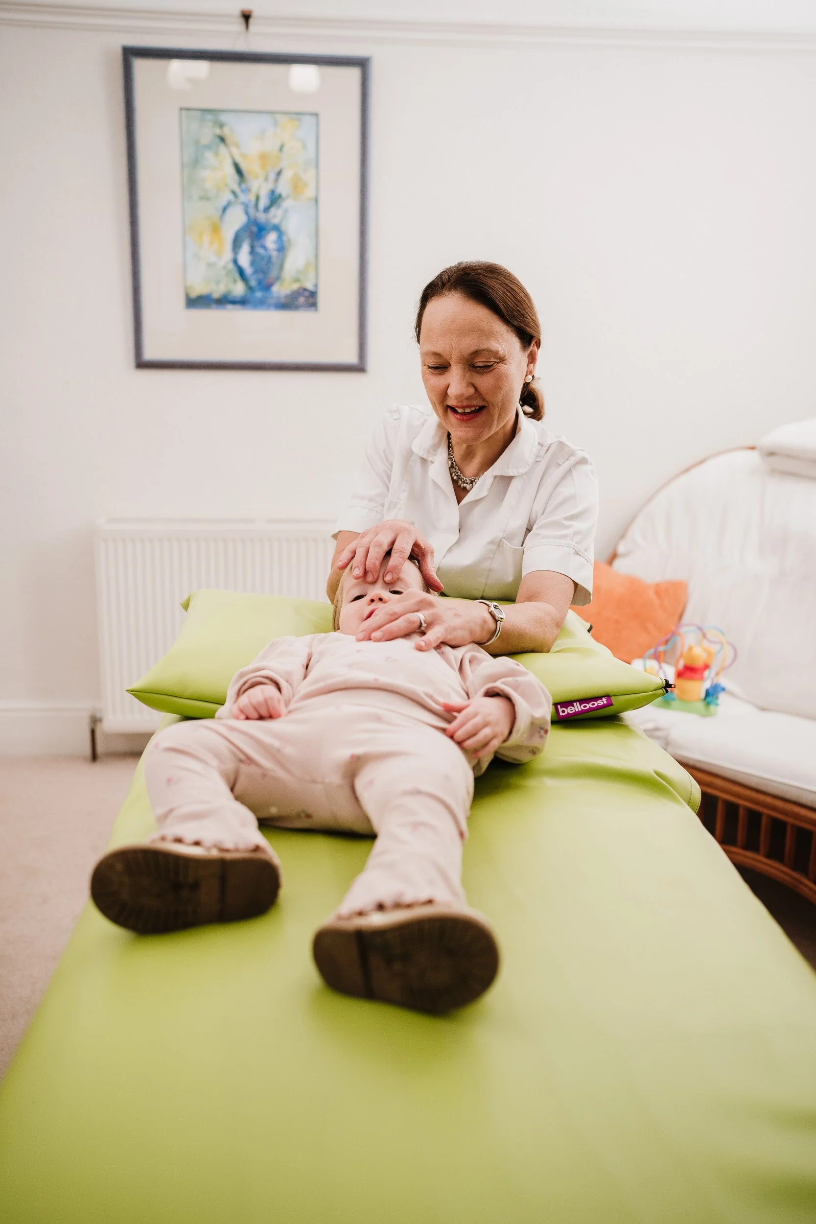 an infant being treated by an osteopath in North Bristol