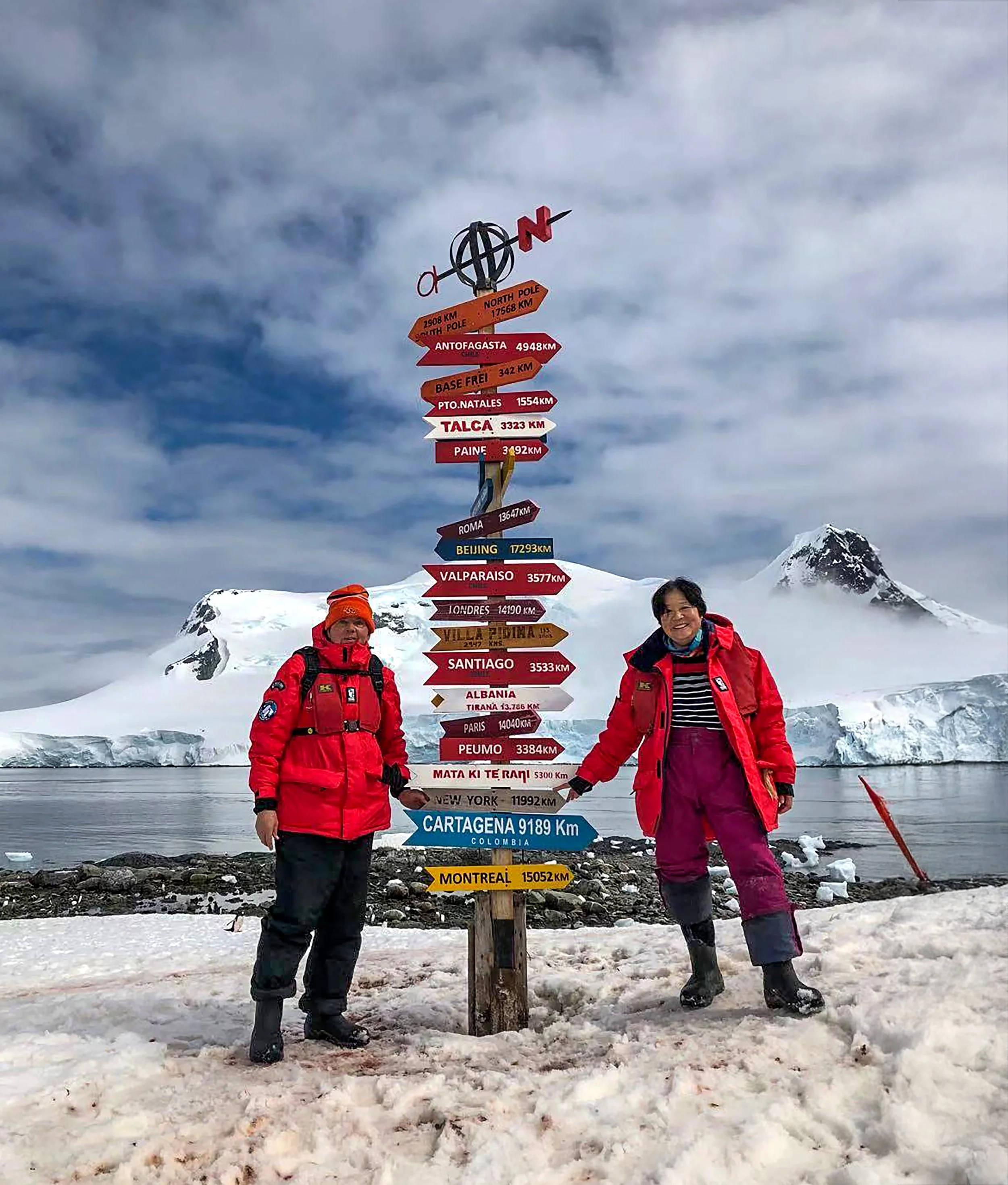 Rich and Jingru at the Directions sign in Antarctica