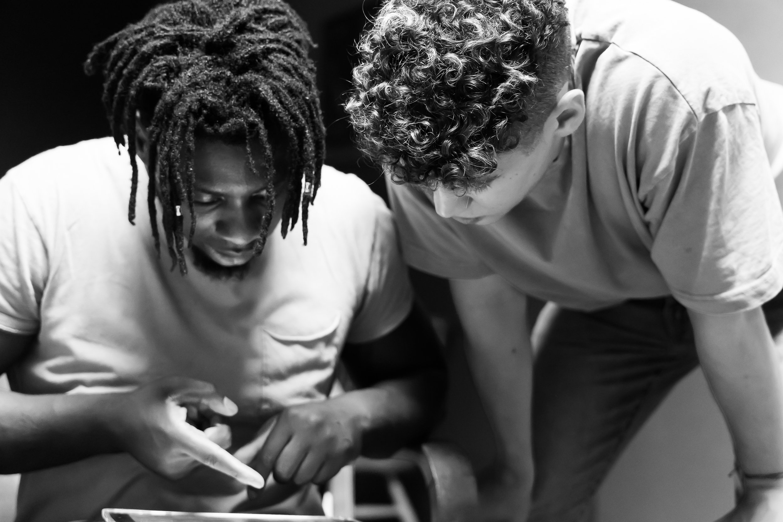 Behind the scenes shot of a director and cinematographer
