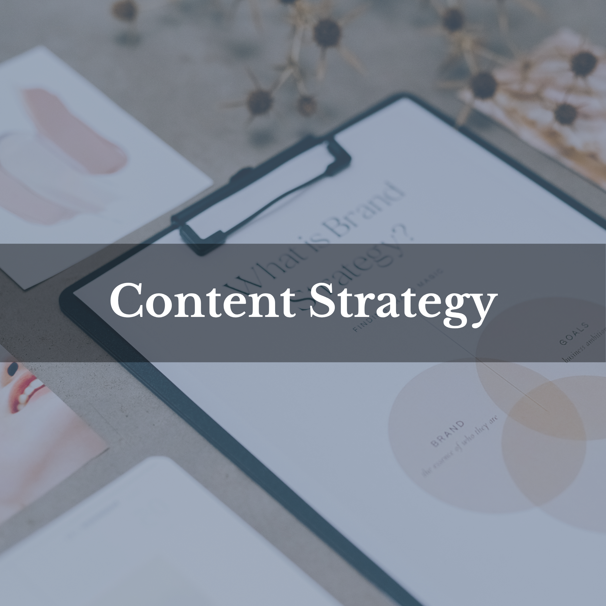 A clipboard with a paper titled 'What is Your Brand?' lying on a flat surface, surrounded by various printed materials, with the words 'Content Strategy' overlaid in the center.