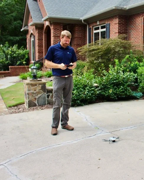 Geometric drawing of an outline square with sections divided by vertical, horizontal, and diagonal lines.