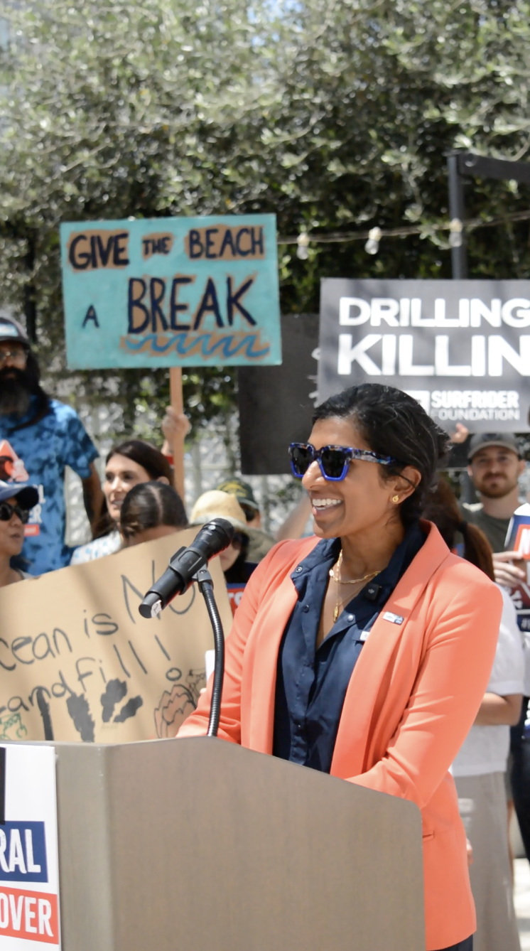 Anupa Asokan smiling while speaking at event