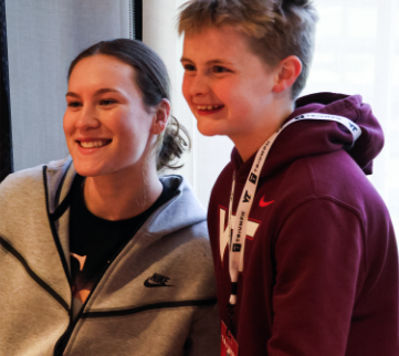 Cayla King taking photos and signing autographs at the 2024 Spring Game