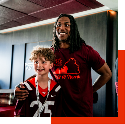 Dorian Strong taking photos with fans after the 2024 Spring Game