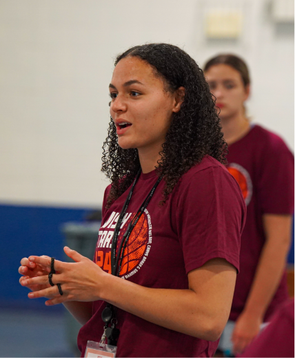 mackenzie nelson instructing the girls during the 2024 Swish with the stars girls basketball camp.