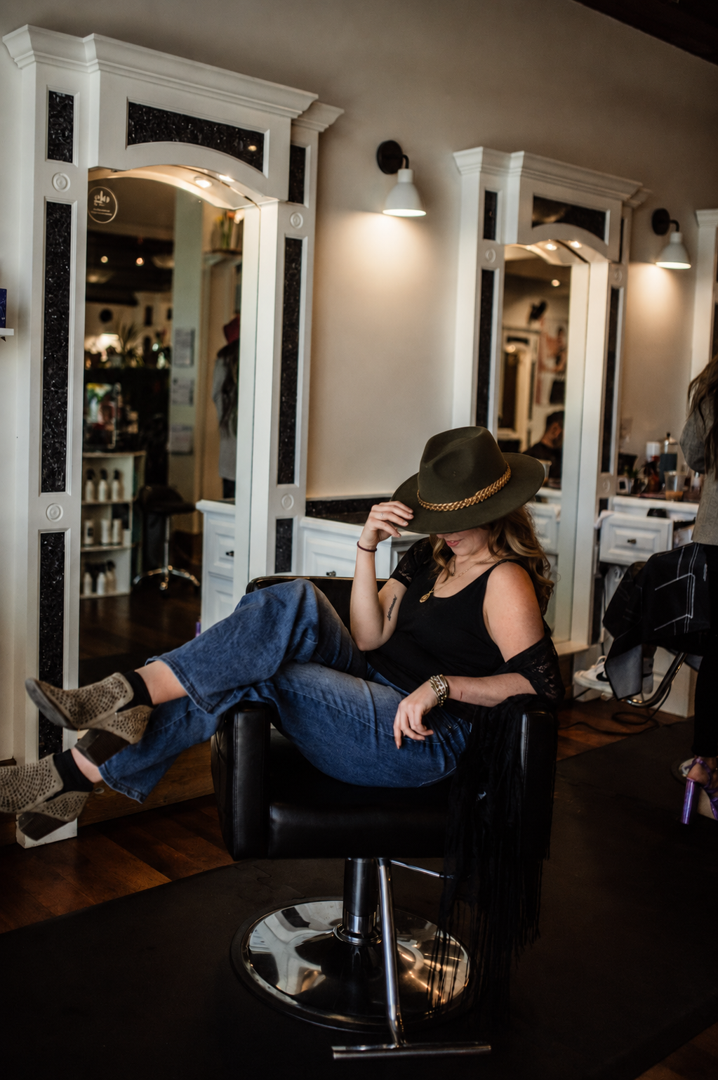 Girl holding haircutting shears and facing the camera.