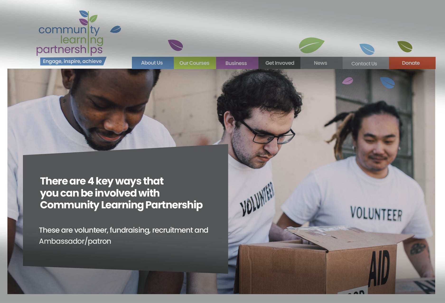 Three volunteers in white shirts labeled 'VOLUNTEER' and 'AID' are arranging boxes. The webpage header shows navigation links for 'About Us,' 'Our Courses,' 'Business,' 'Get Involved,' 'News,' 'Contact Us,' and 'Donate.' The logo reads 'Community Learning Partnership' with a stylized plant and leaves above the text.