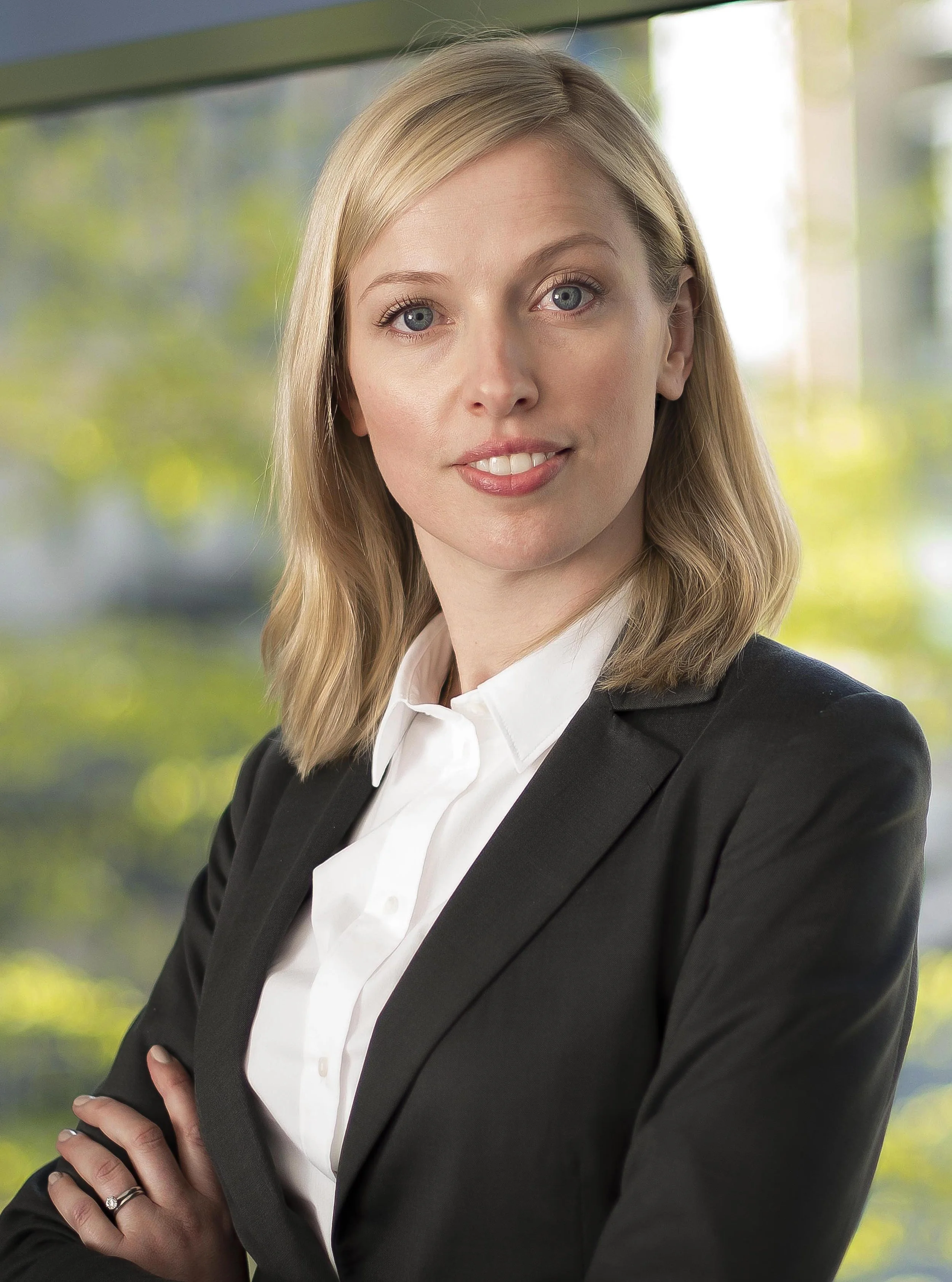 professional headshot of a woman with arms folded photographed on location with studio lighting, Leeds