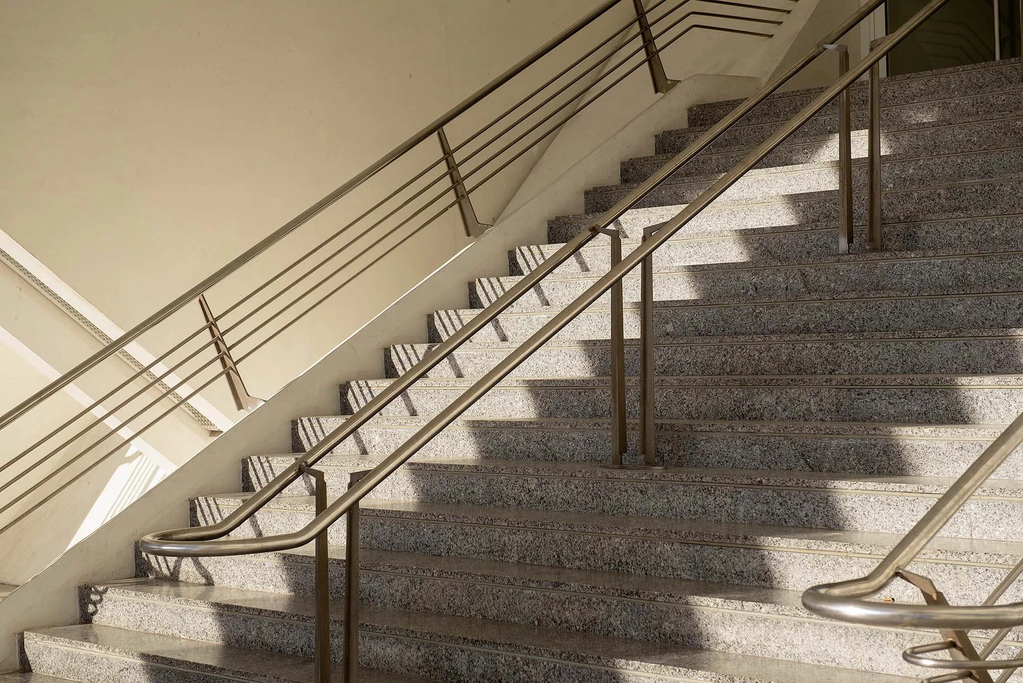 modern architectural staircase in dramatic shadow