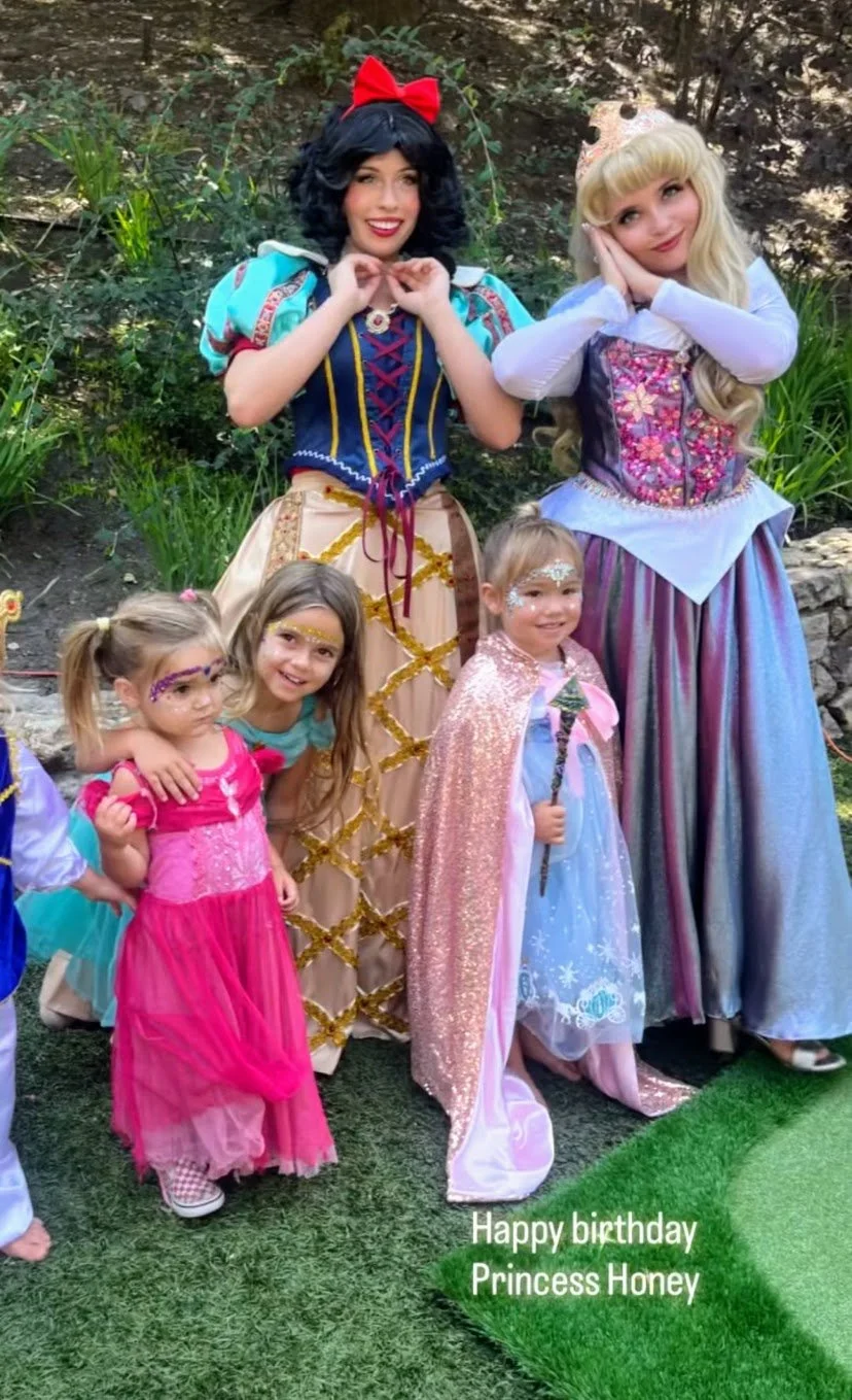 Birthday Princess Celebration with Snow White, Cinderella and Elsa princesses where they are posing with Birthday Girl in Los Angeles
