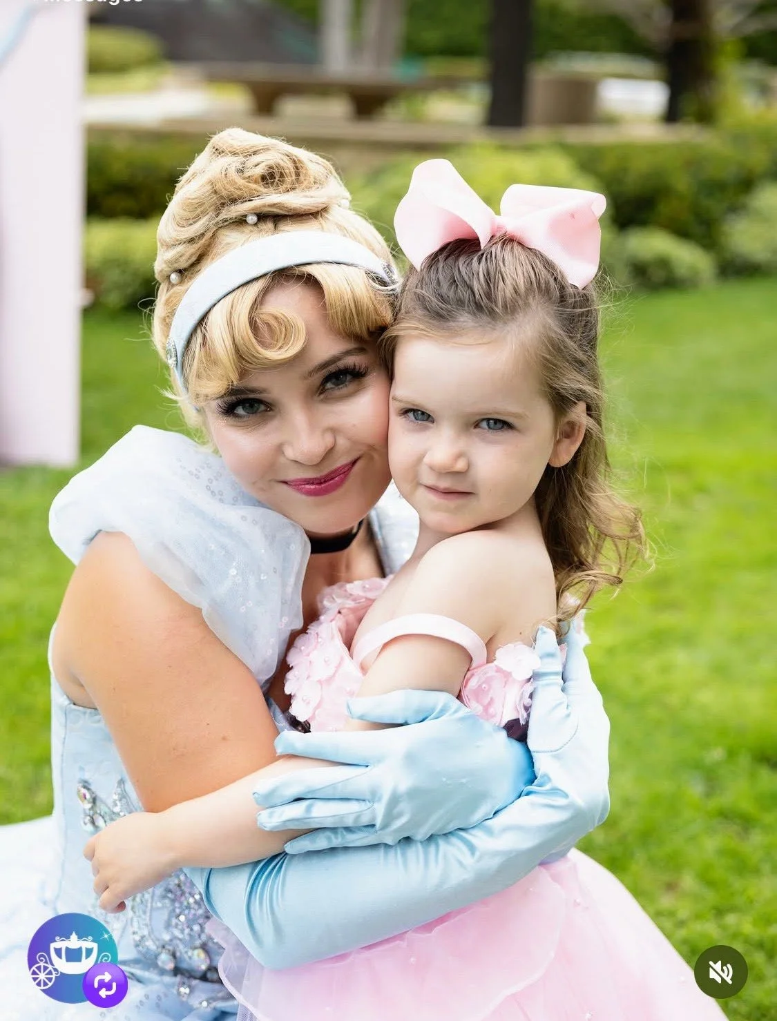 Cinderella hugging little girl at Princess Party in Los Angeles