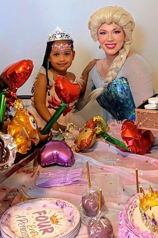 elsa-birthday-party-tampa-bay-princess-with-child.jpeg