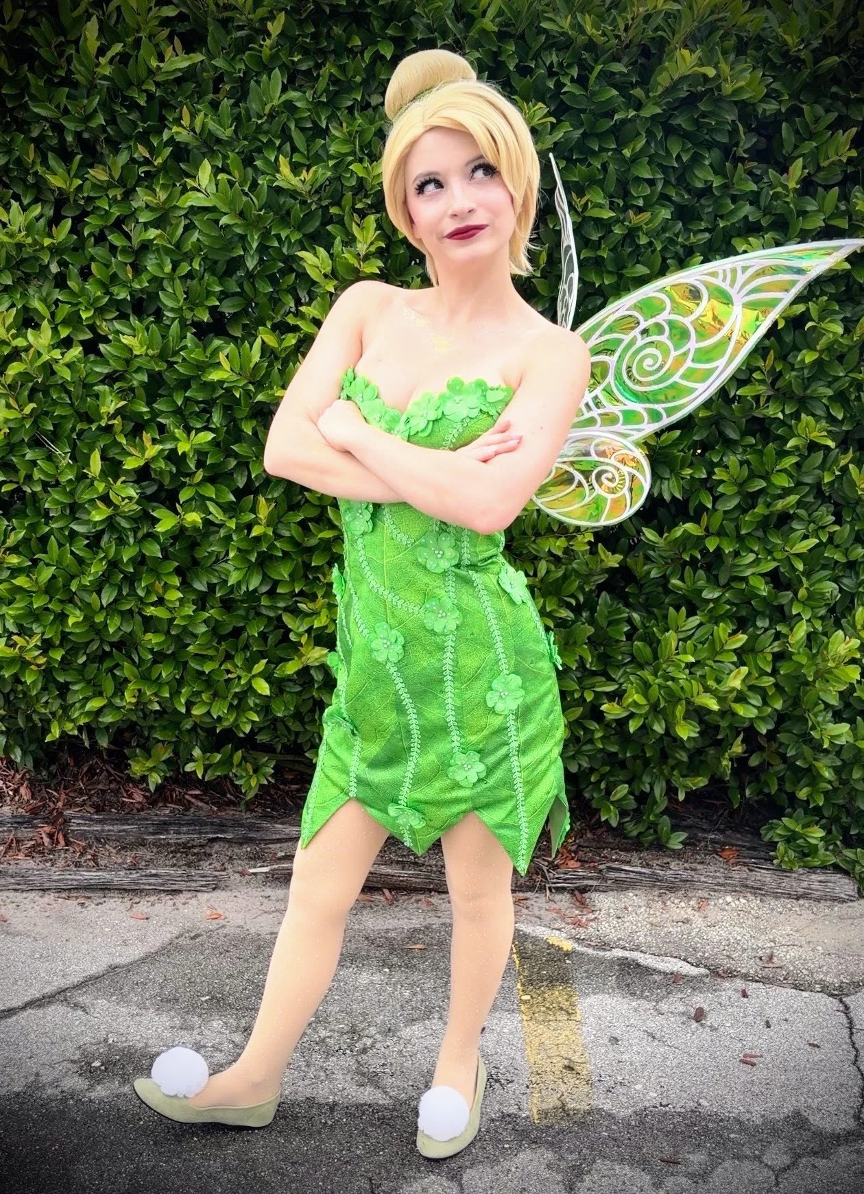 Tinkerbell dressed in her icon green dress and wings at a Birthday Fairy Celebration in the Tampa Bay Area