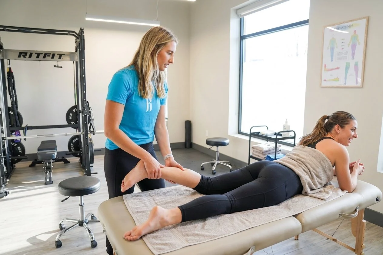 Patient receiving manual therapy on their lower leg from a physical therapist at a performance physical therapy clinic in Chattanooga, TN