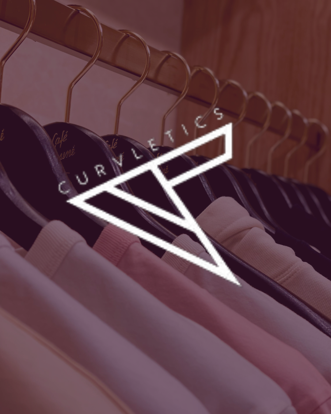 Clothing rack with polo shirts and hanger with logo overlay.