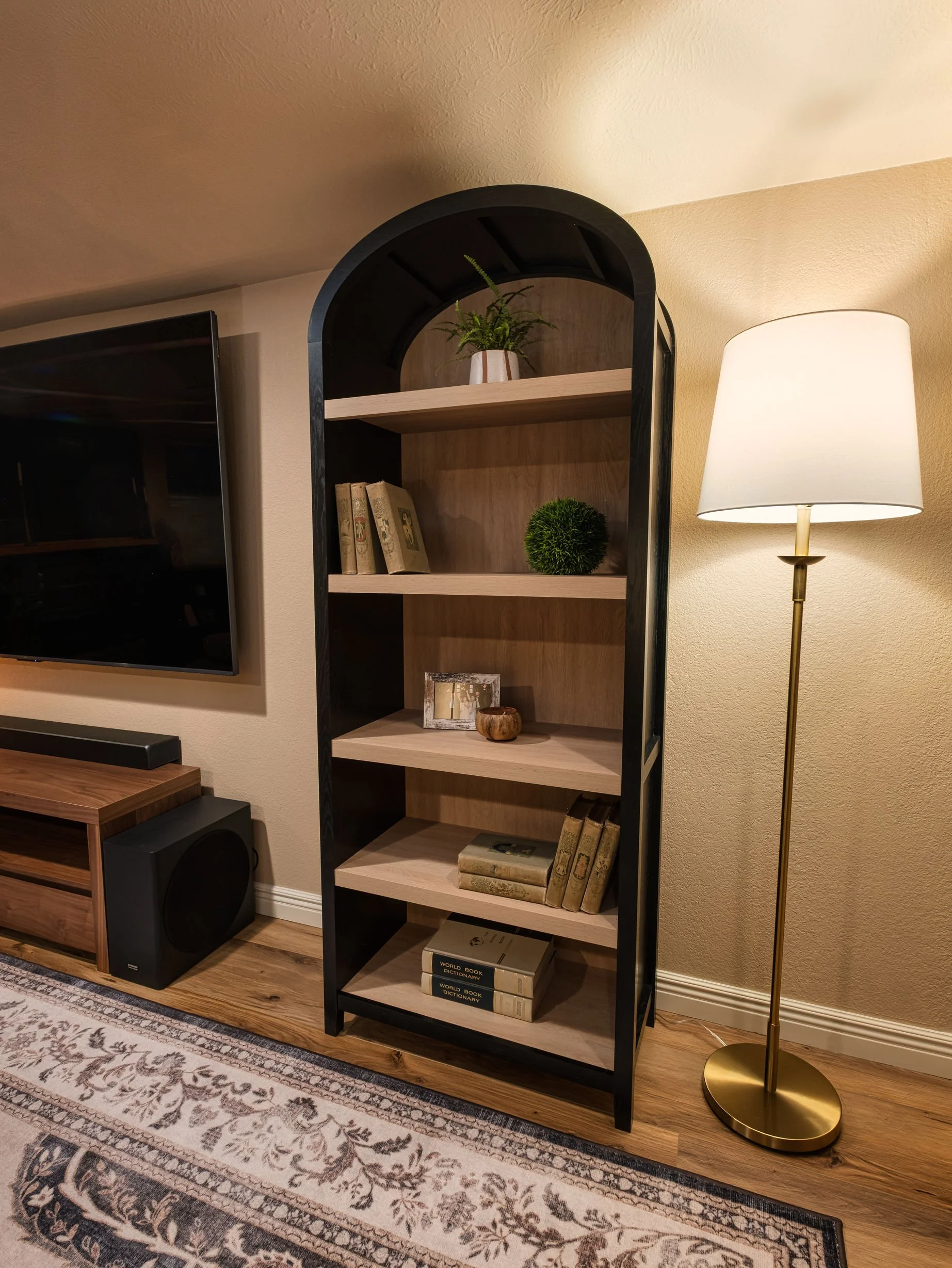 Client Profile: Newlyweds remodel a basement living room.

Design: Concept words are cozy, comfortable, easeful, and warm. 