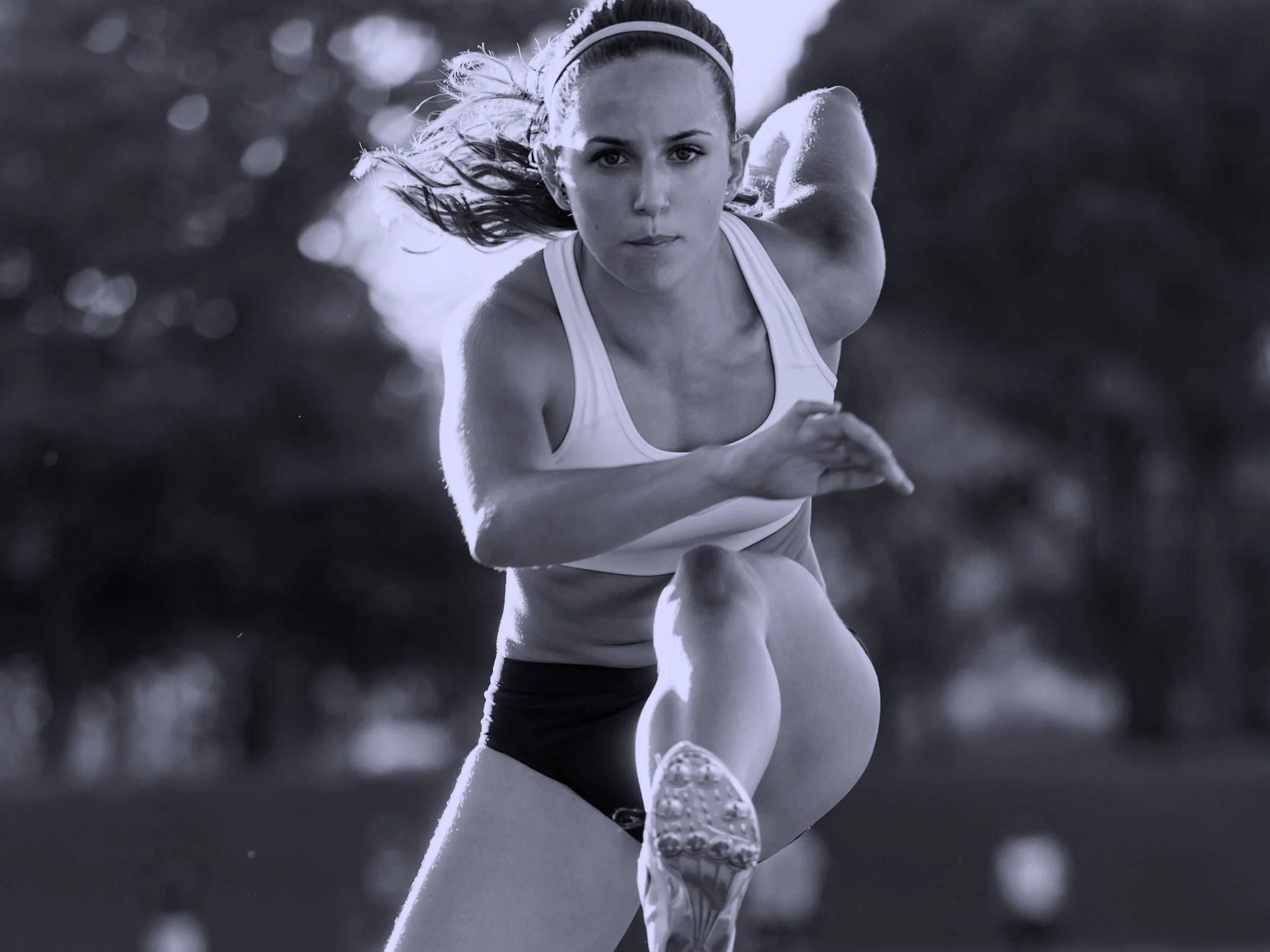 young-athlete-jumping-over-a-hurdle-during-trainin-2021-08-26-20-17-32-utc.jpg