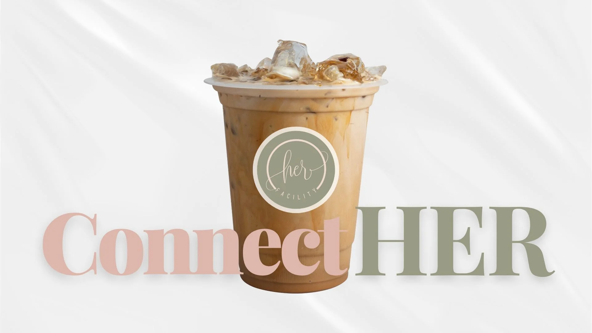 iced latted with the logo of "Her Facility" on the cup