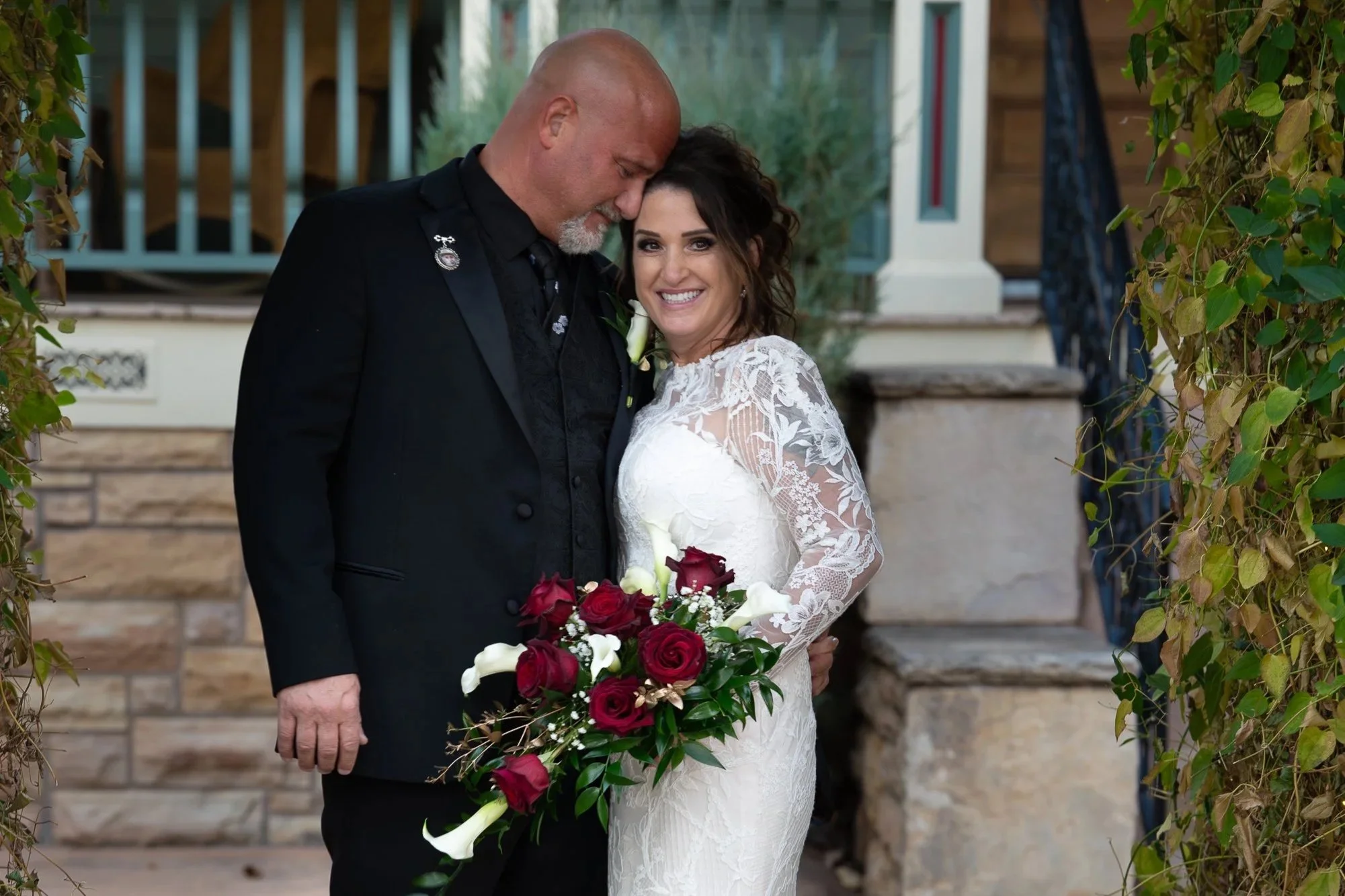Romantic Colorado wedding couple sharing an intimate portrait moment on their wedding day
