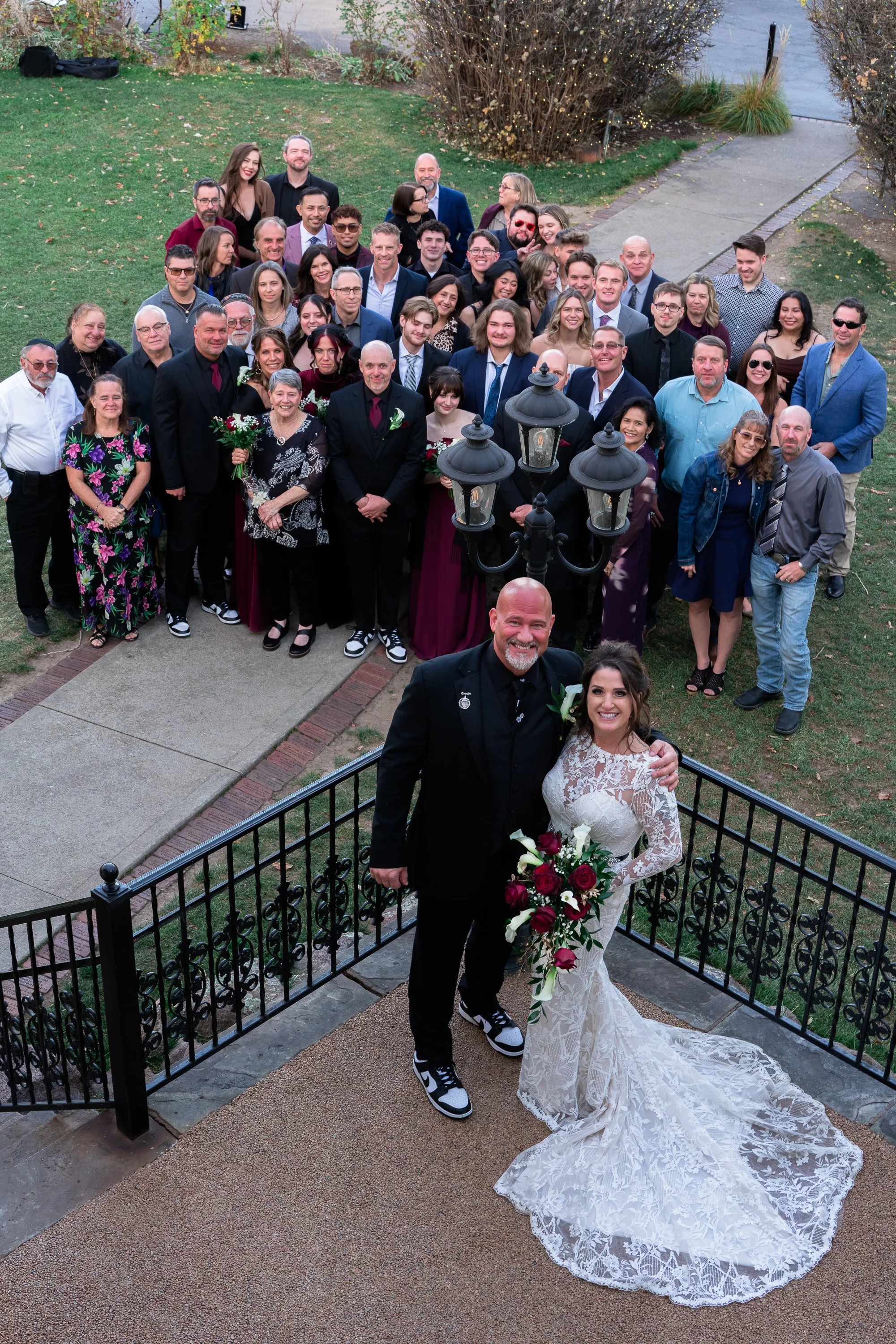 Balcony shot of Bride and Groom with all guests