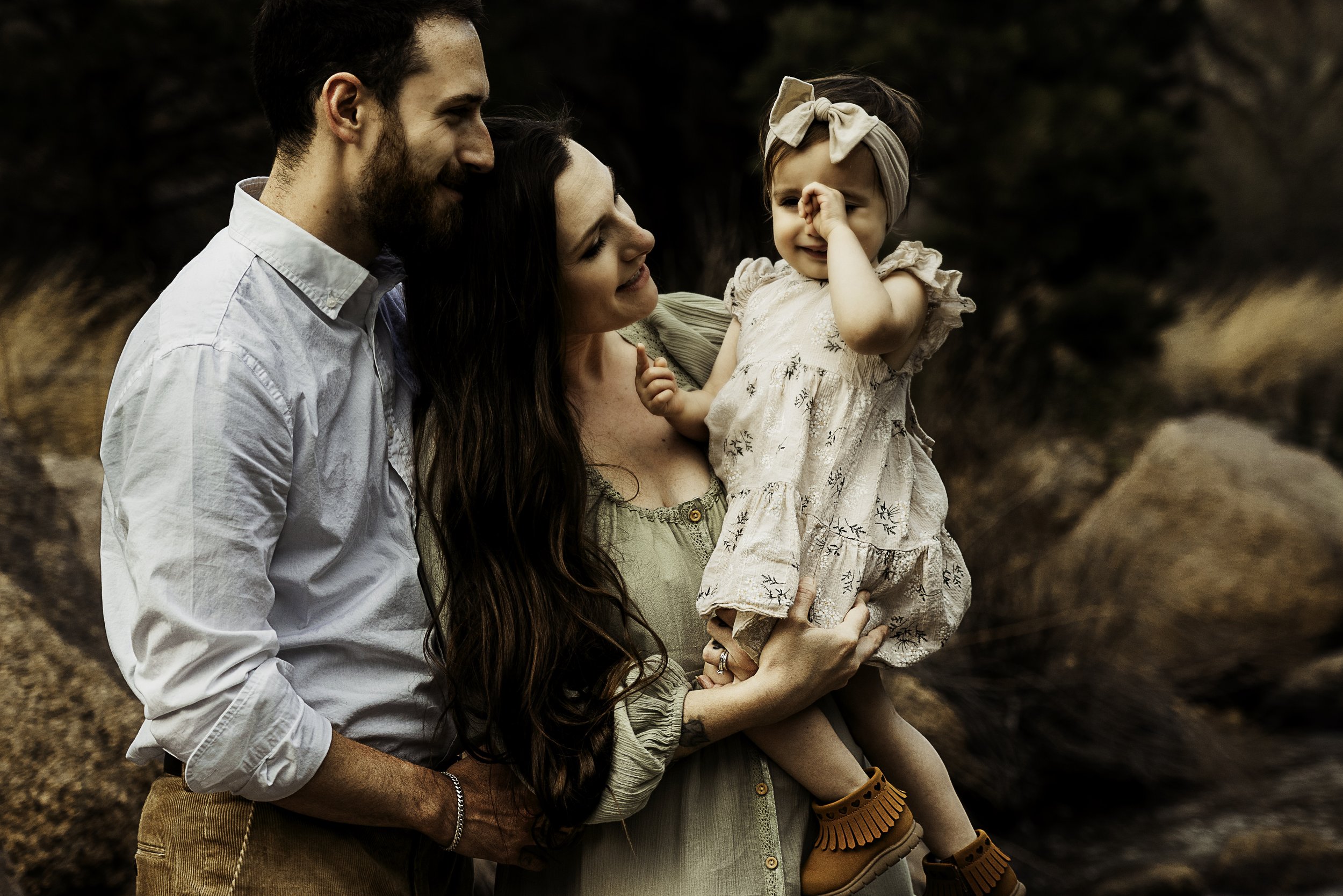 Mom and dad try to comfort baby who is getting tired and upset