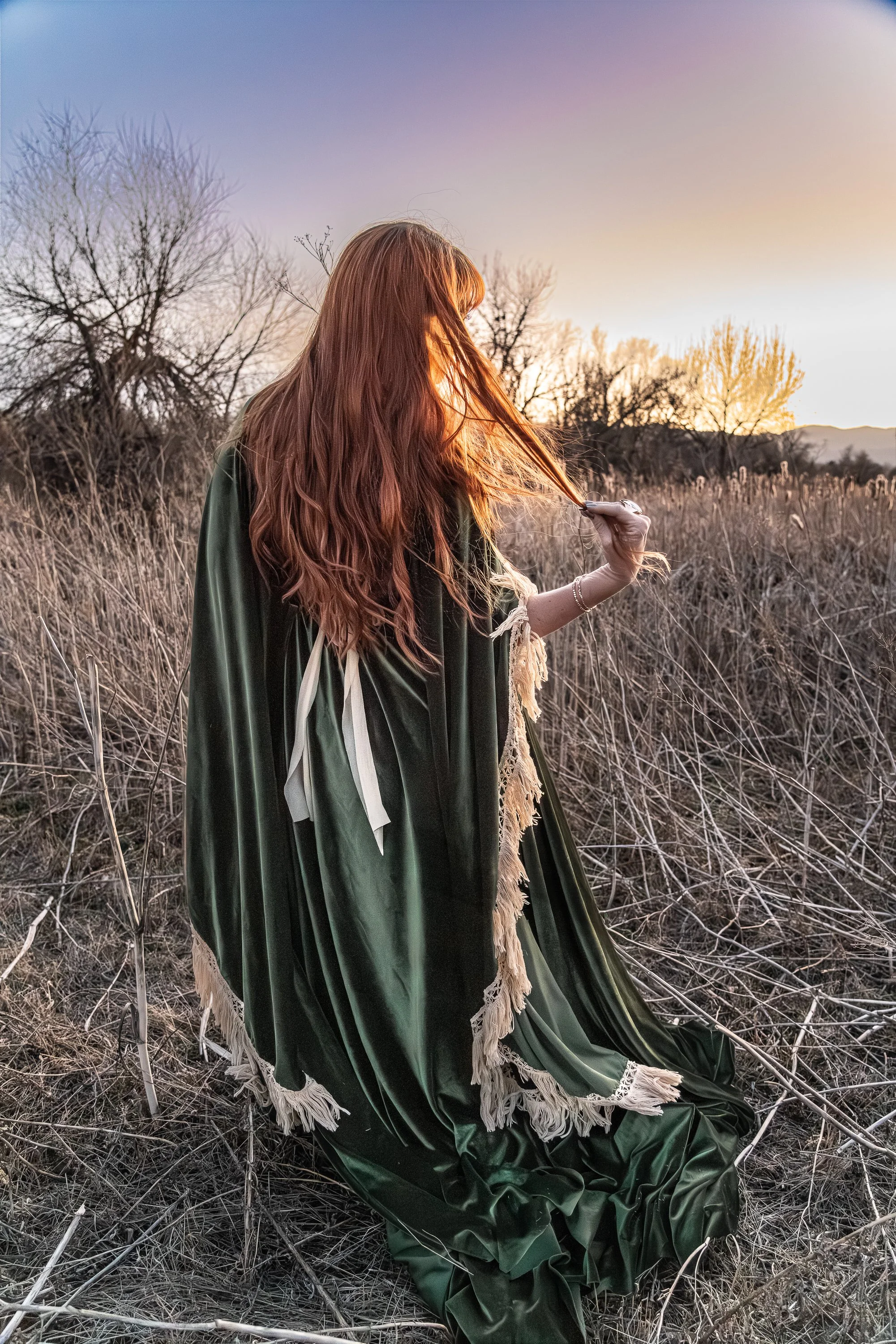 Watching the sun go down twirling hair 