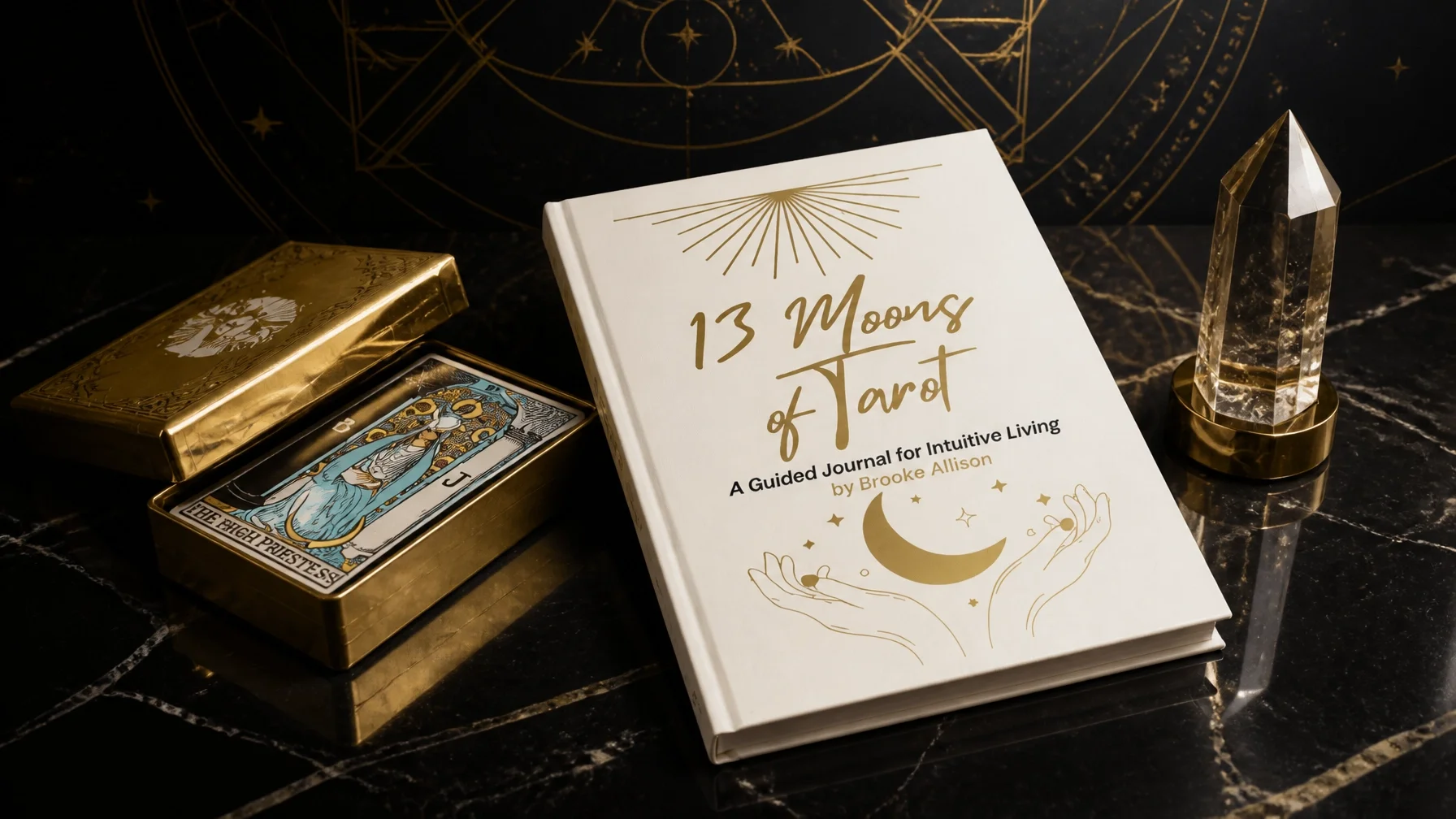A guided journal titled '13 Moons of Tarot' by Brooke Allison, a tarot card deck with the High Priestess card visible, and a clear crystal standing on a black marble surface with gold accents and celestial designs.