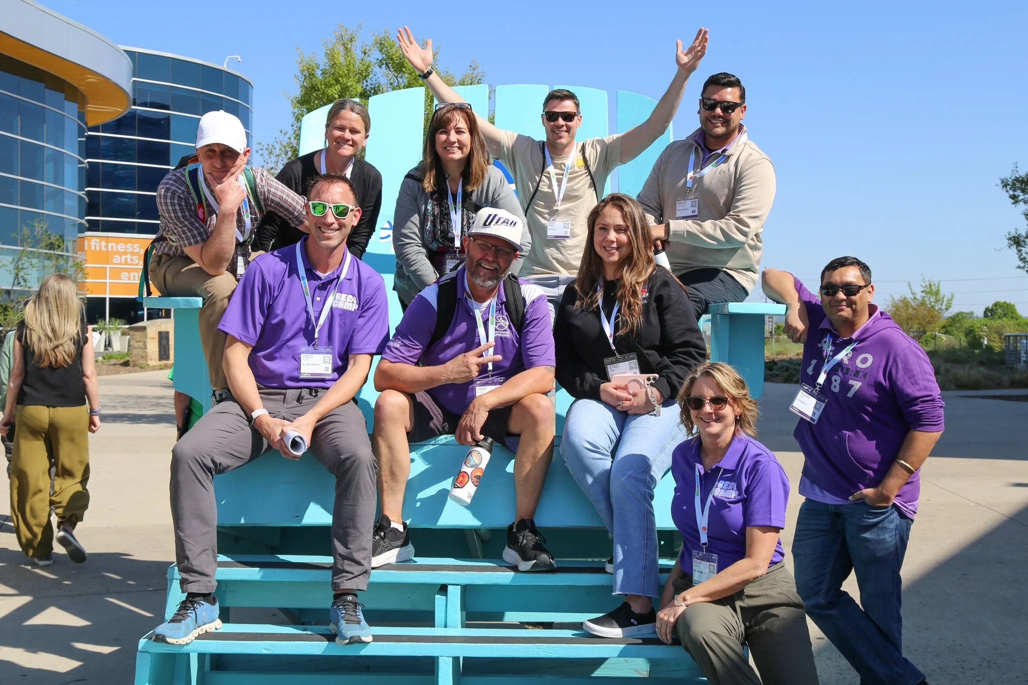 Purple team poses for a group photo outside The Epic