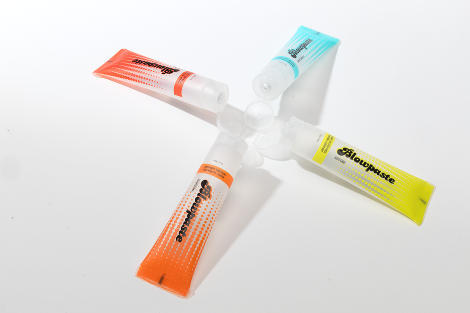 Blowpaste 4-pack edible vegan personal lubricant, all four flavors (mint, cinnamon, lime, orange) shown in a pinwheel on a white background
