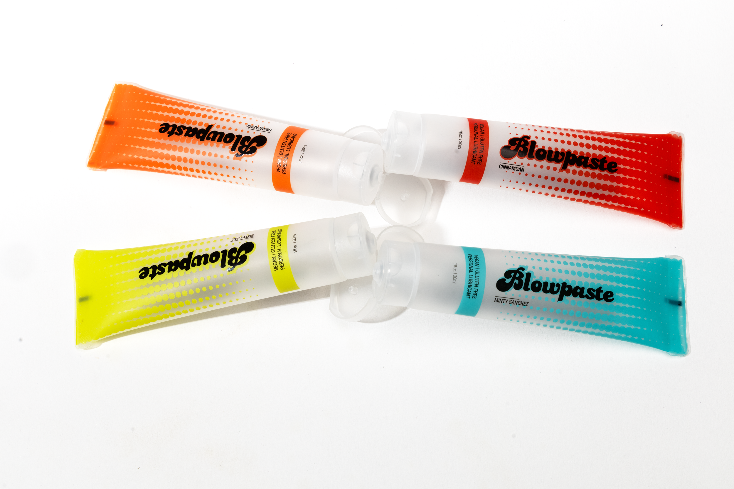 Blowpaste 4-pack edible vegan personal lubricant, all four flavors (mint, cinnamon, lime, orange) shown on a white background