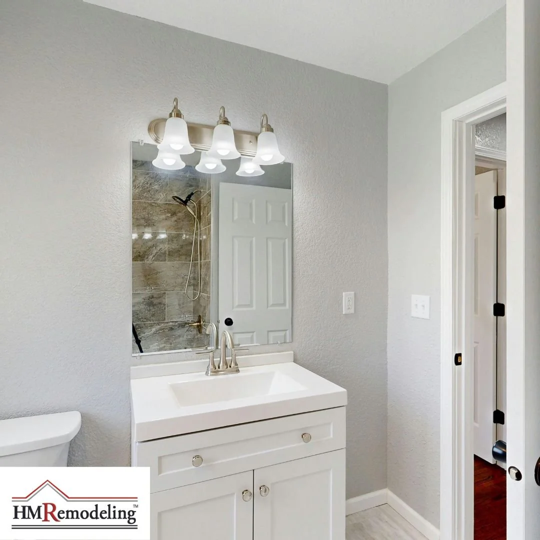 Updated bathroom vanity and lighting installed by HM Remodeling of South Bend to improve brightness and daily usability