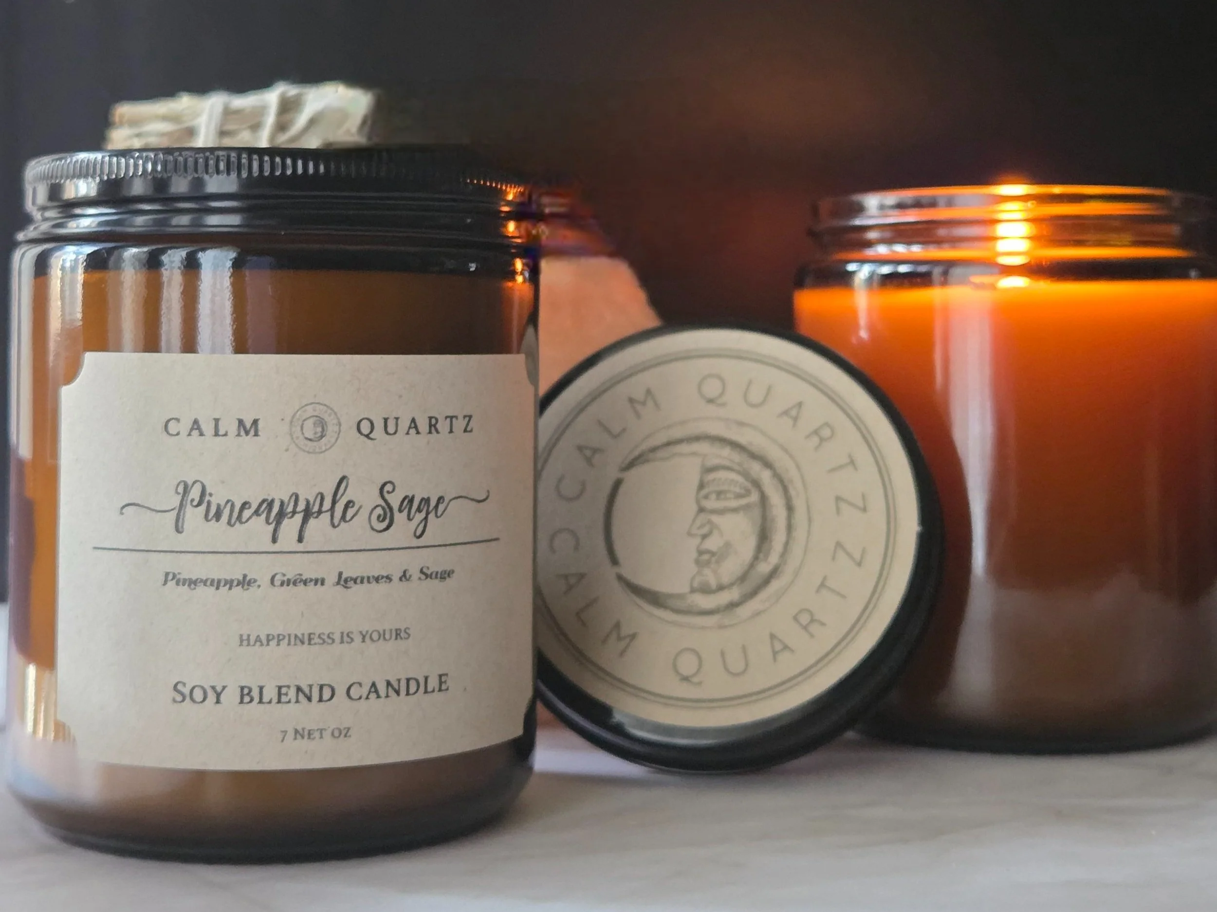 pineapple sage candle on a table in a simple setting