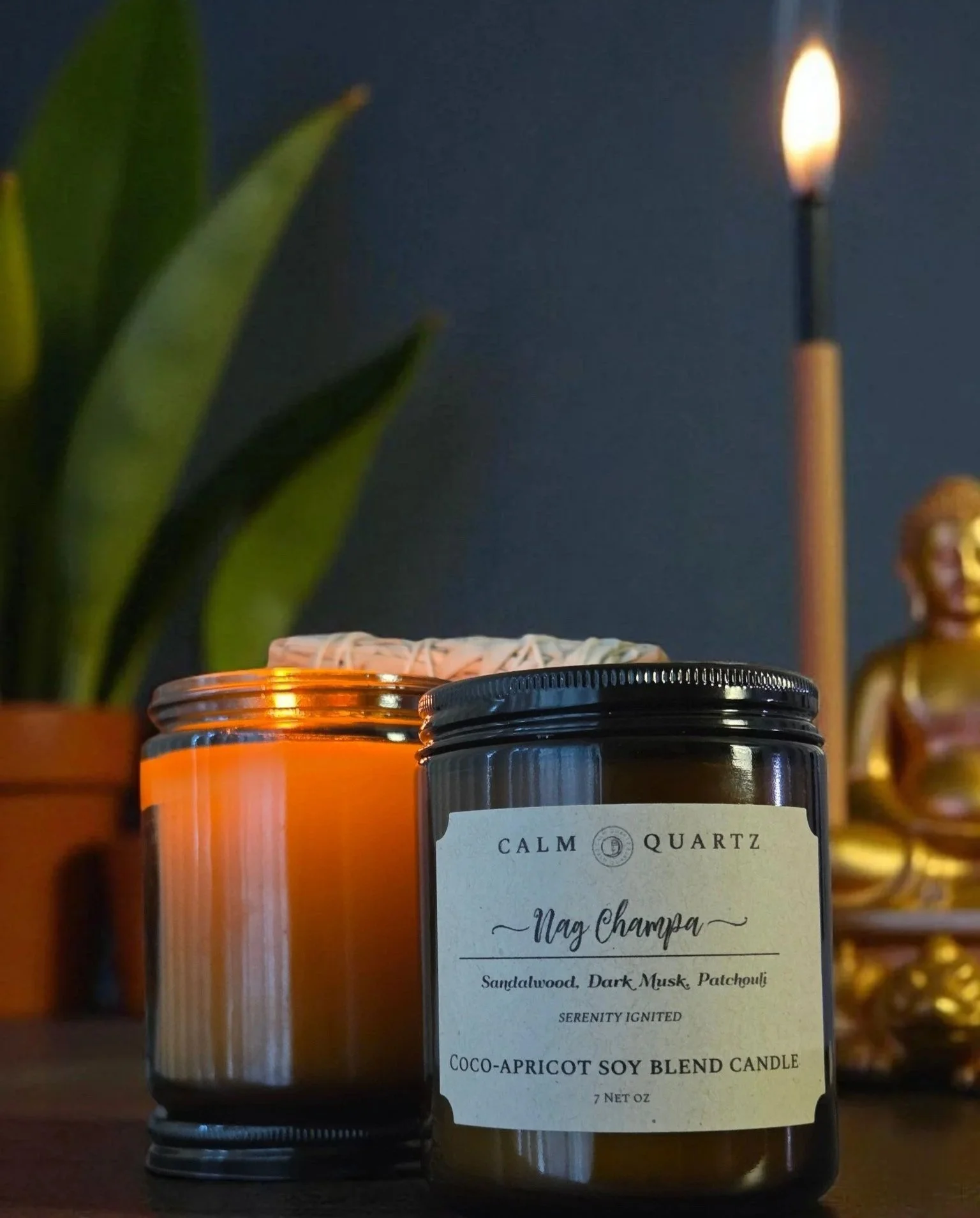 nag champa in front of lit incense next to a buhdda statue