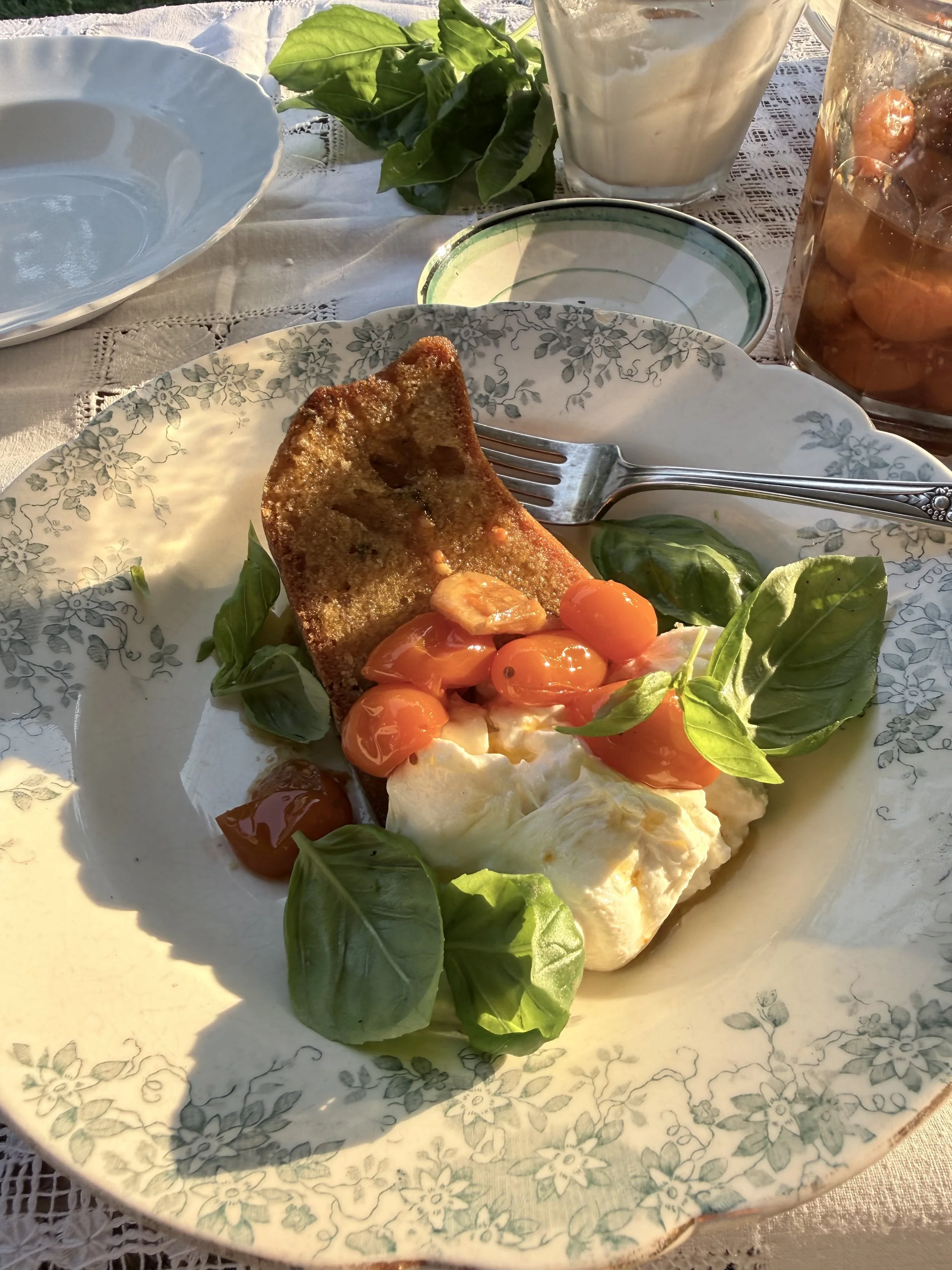 Savory garlic and olive oil cake with tomato confit and burrata