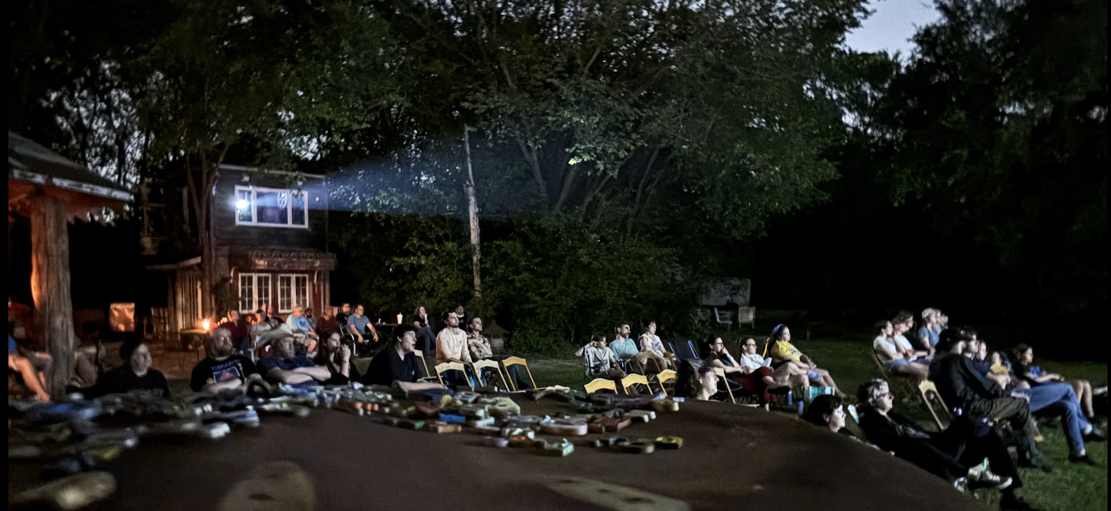 Audience watching an outdoor film screening at the Sekrit Theater in Austin.