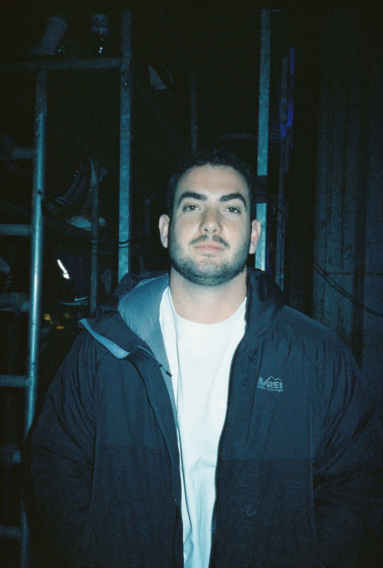 A person smiles in front of a camera