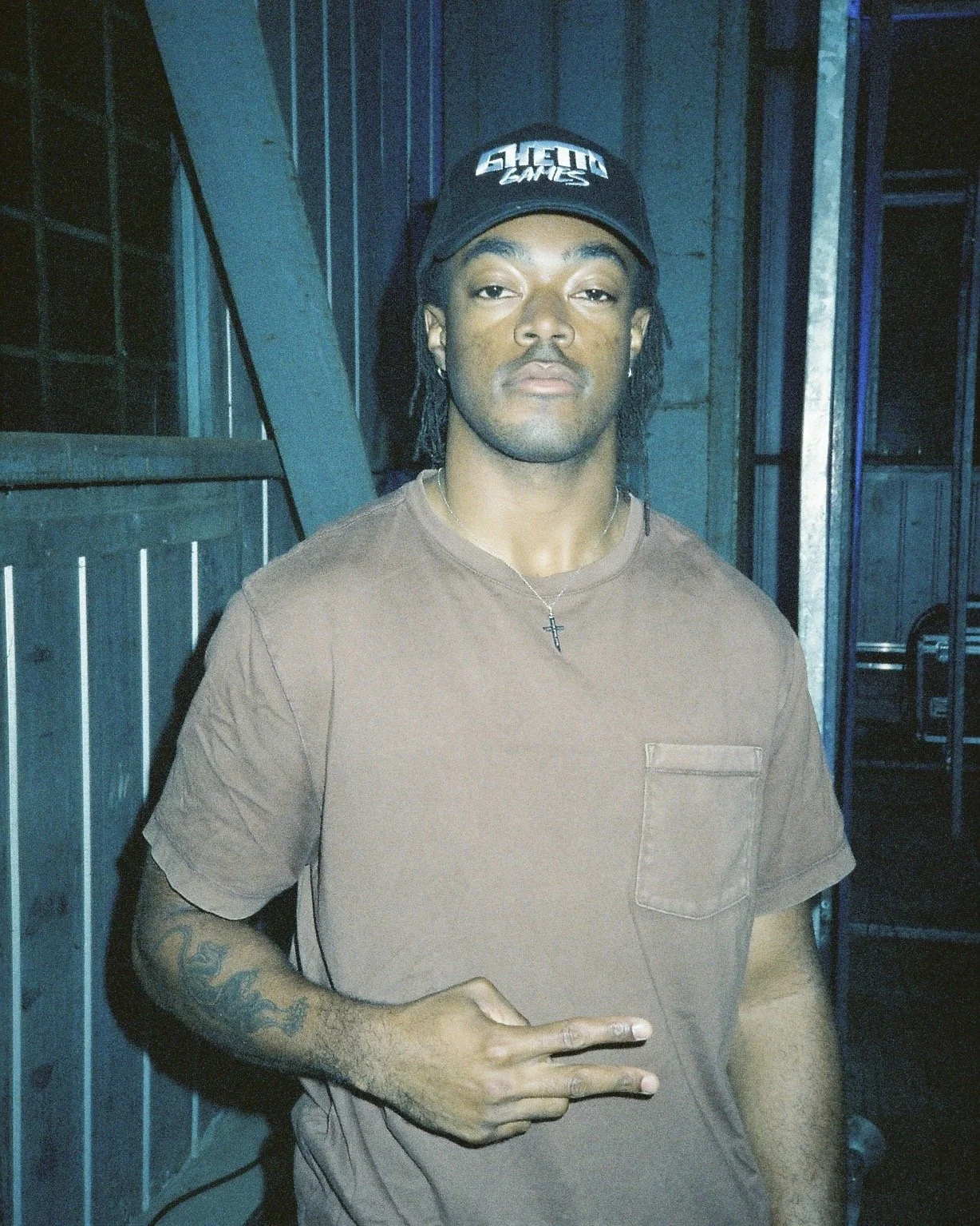 A person smiles in front of a camera