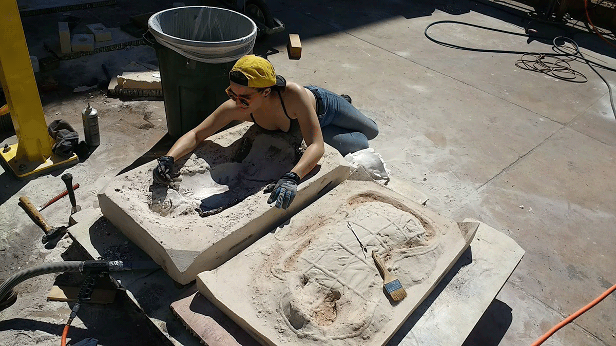 Prepping both sides of 500 lb sand mold for casting. 