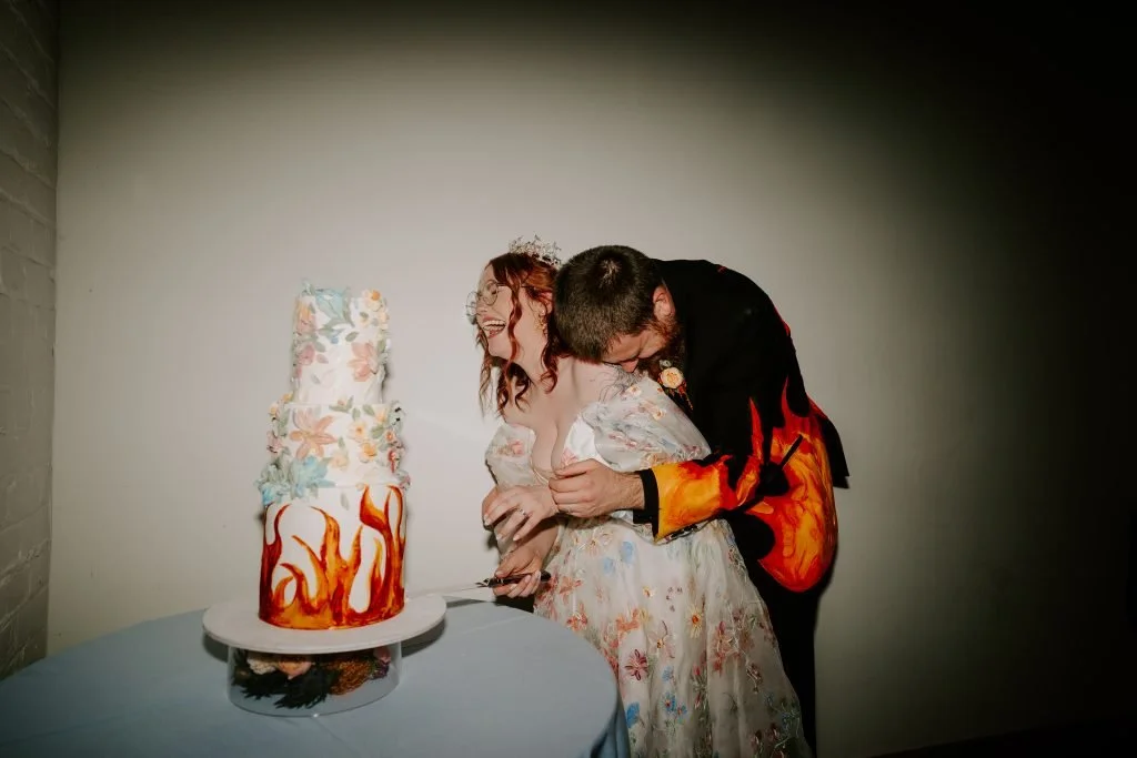fire themed wedding cake and outfit