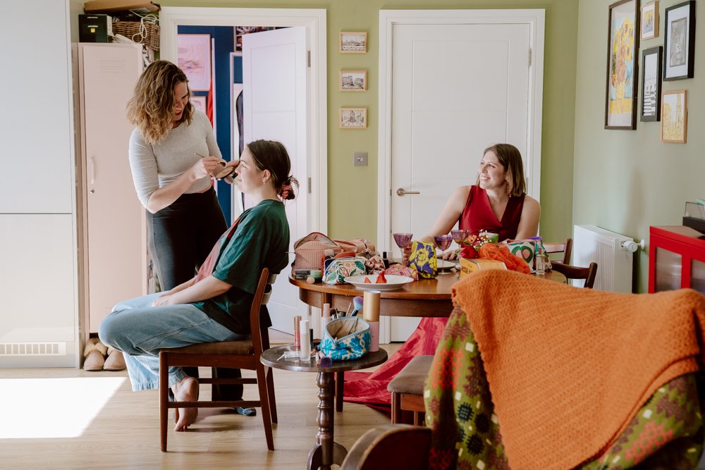 two brides get ready at home