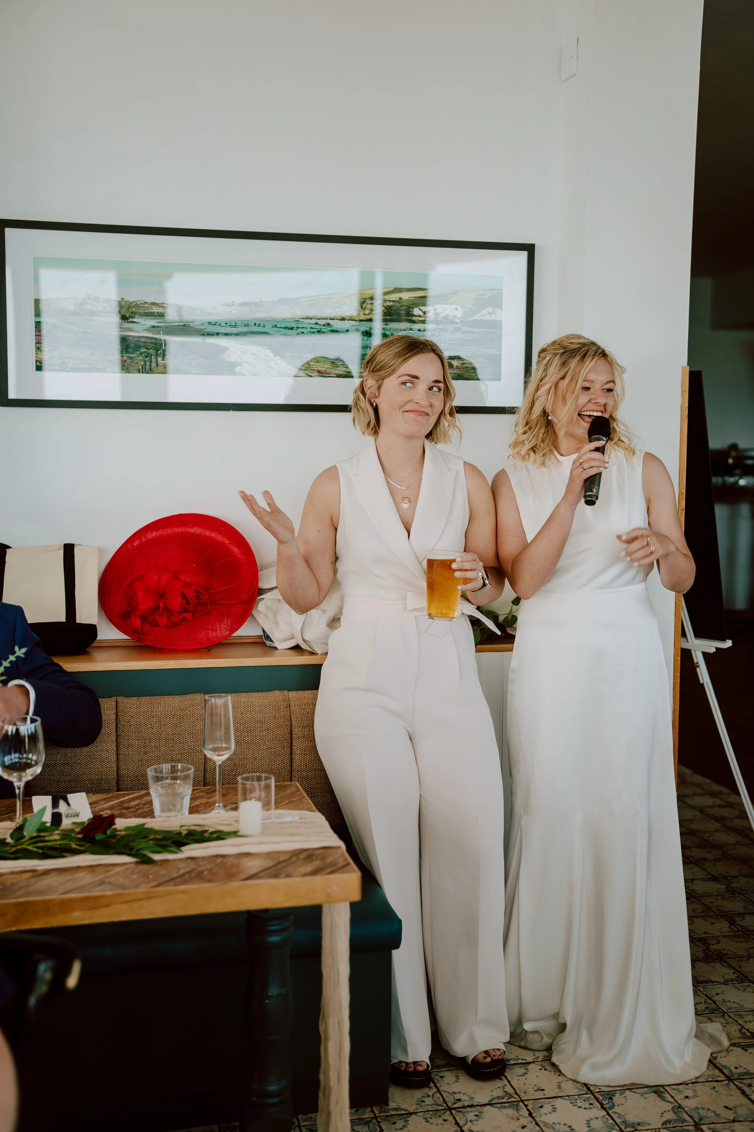 two brides give a speech at the seahorse brighton