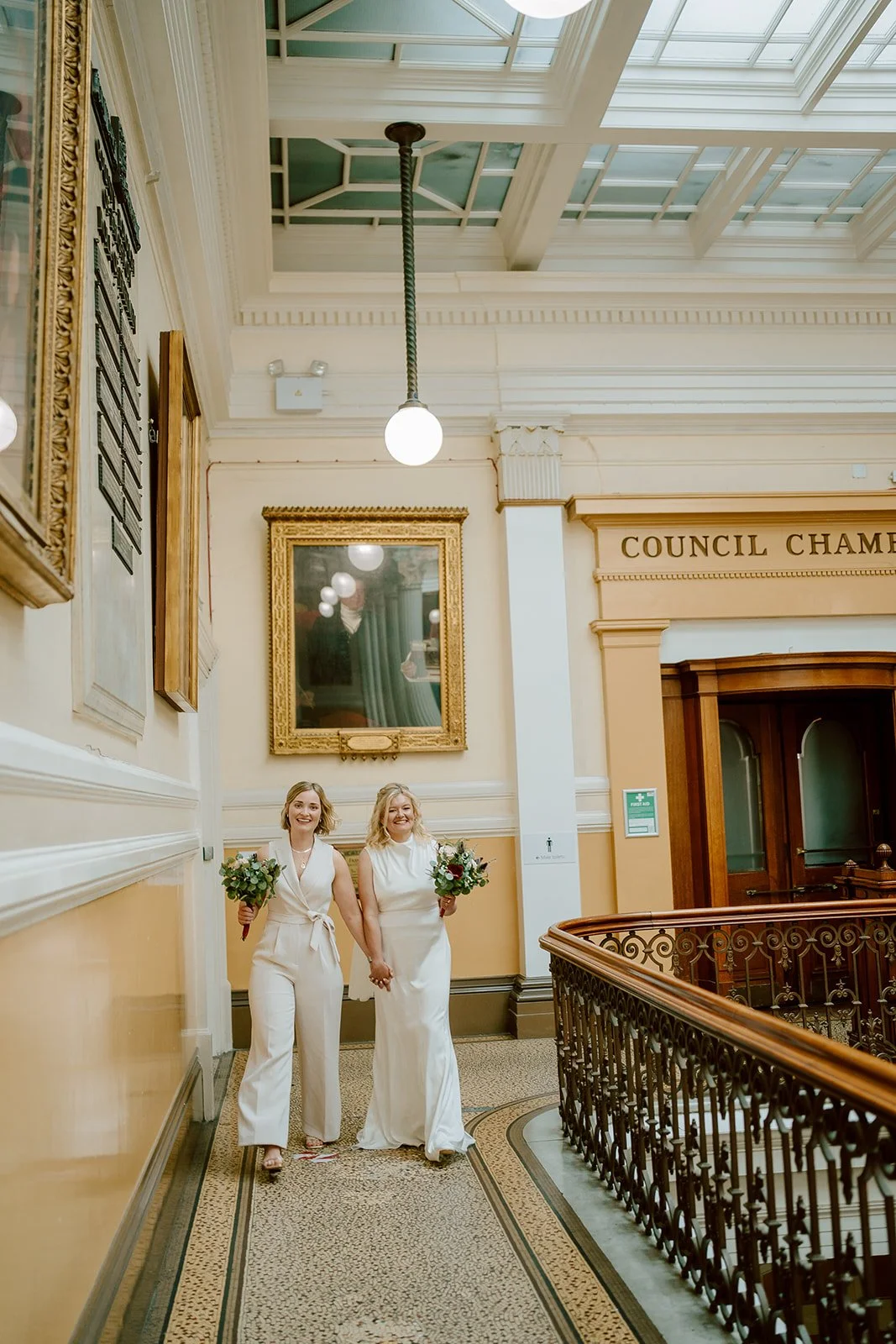 two brides hand in hand just got married at brighton town hall