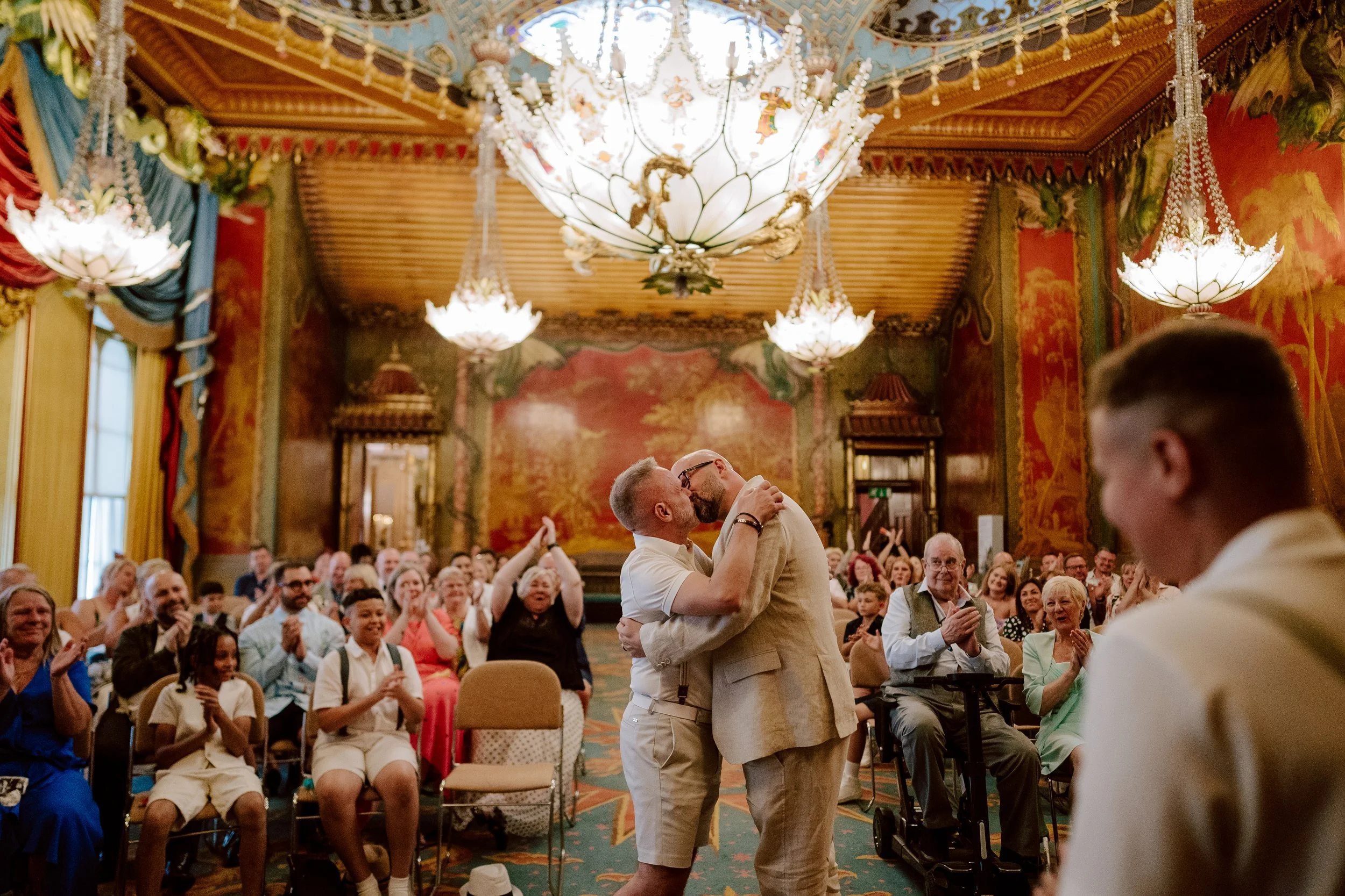 A couple share a first kiss at the royal pavilion wedding in brighton