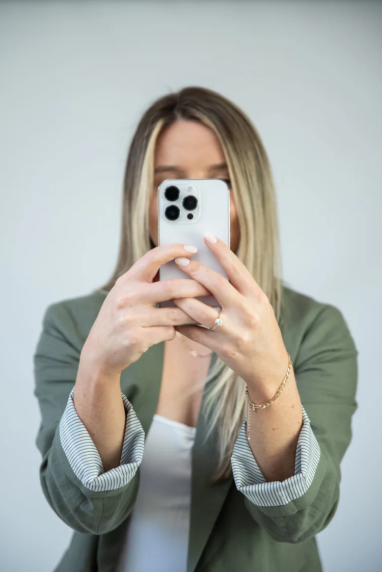 Creator filming content on her phone