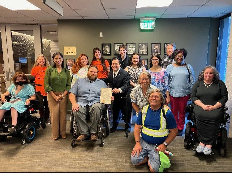 A photo of the members of the Ann Arbor Commission on Disability Issues, from a 2024 city council meeting