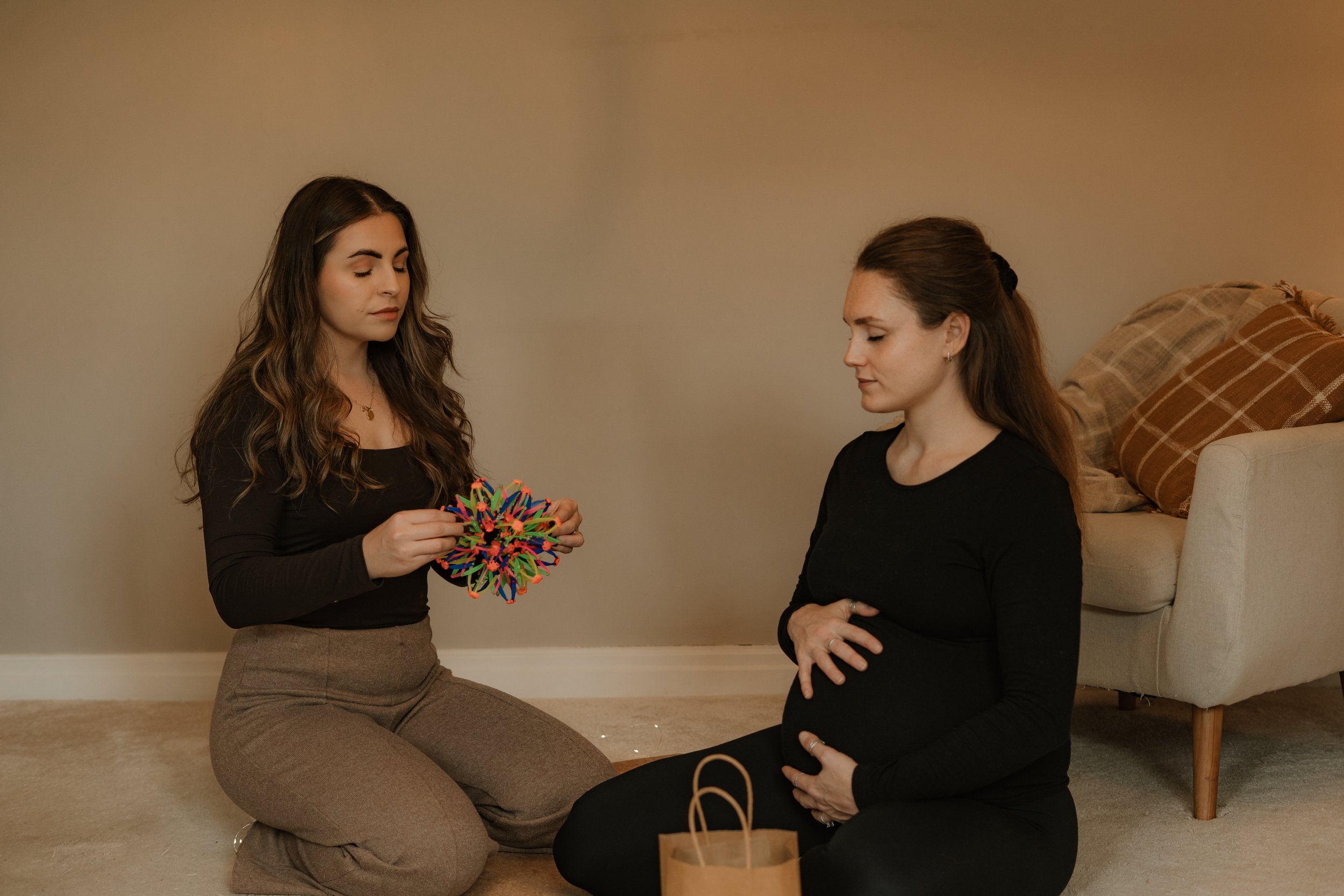 calm caesarean birth course surgeon holding up baby to mum