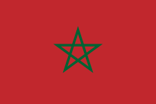 Drapeau rouge avec une étoile verte à cinq branches au centre.